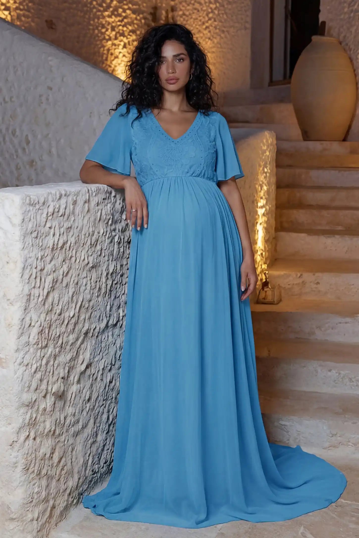 Lace Embroidered Short Flutter Sleeve Maternity Gown Lace embroidered short flutter sleeve maternity gown in sky blue with delicate lace embroidery & flutter sleeves, front view on pregnant model
