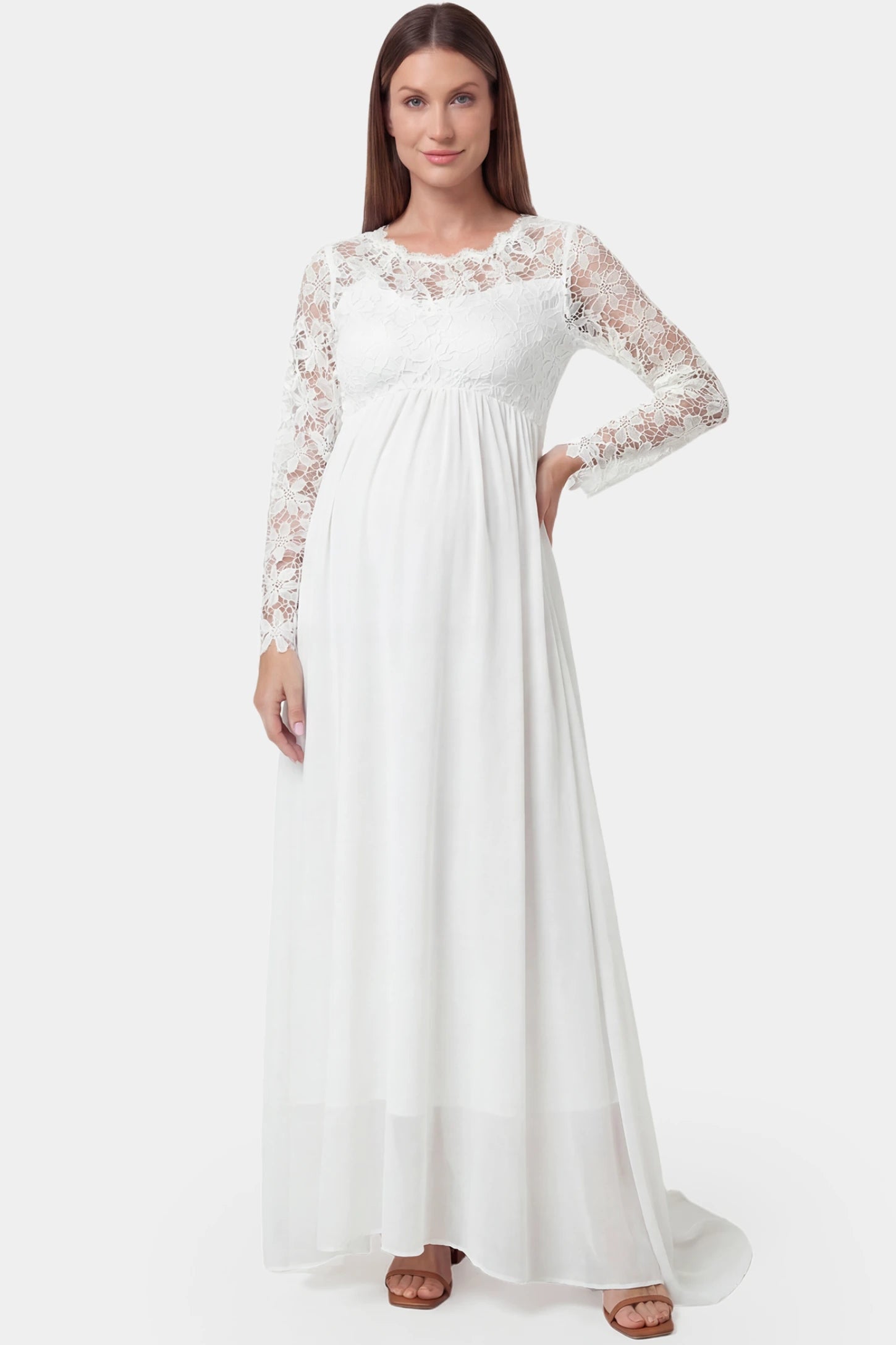 Lace Long Sleeve Full Skirt Maxi Maternity Dress Lace long sleeve full skirt maxi maternity dress in white featuring empire waist in full body front view on a pregnant model