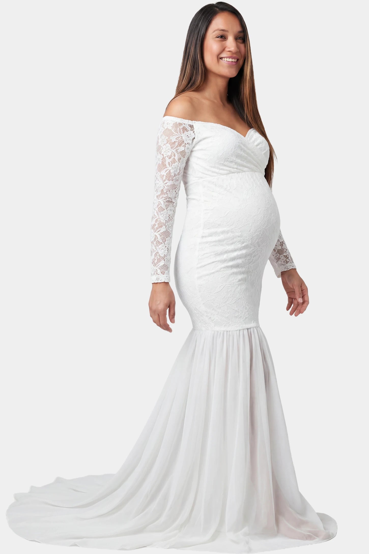 Lace-Spliced Off-Shoulder Long Sleeve Maxi Maternity Gown Lace-spliced off-shoulder long sleeve maxi maternity gown in white featuring high-waisted flowing skirt in side view on a pregnant model