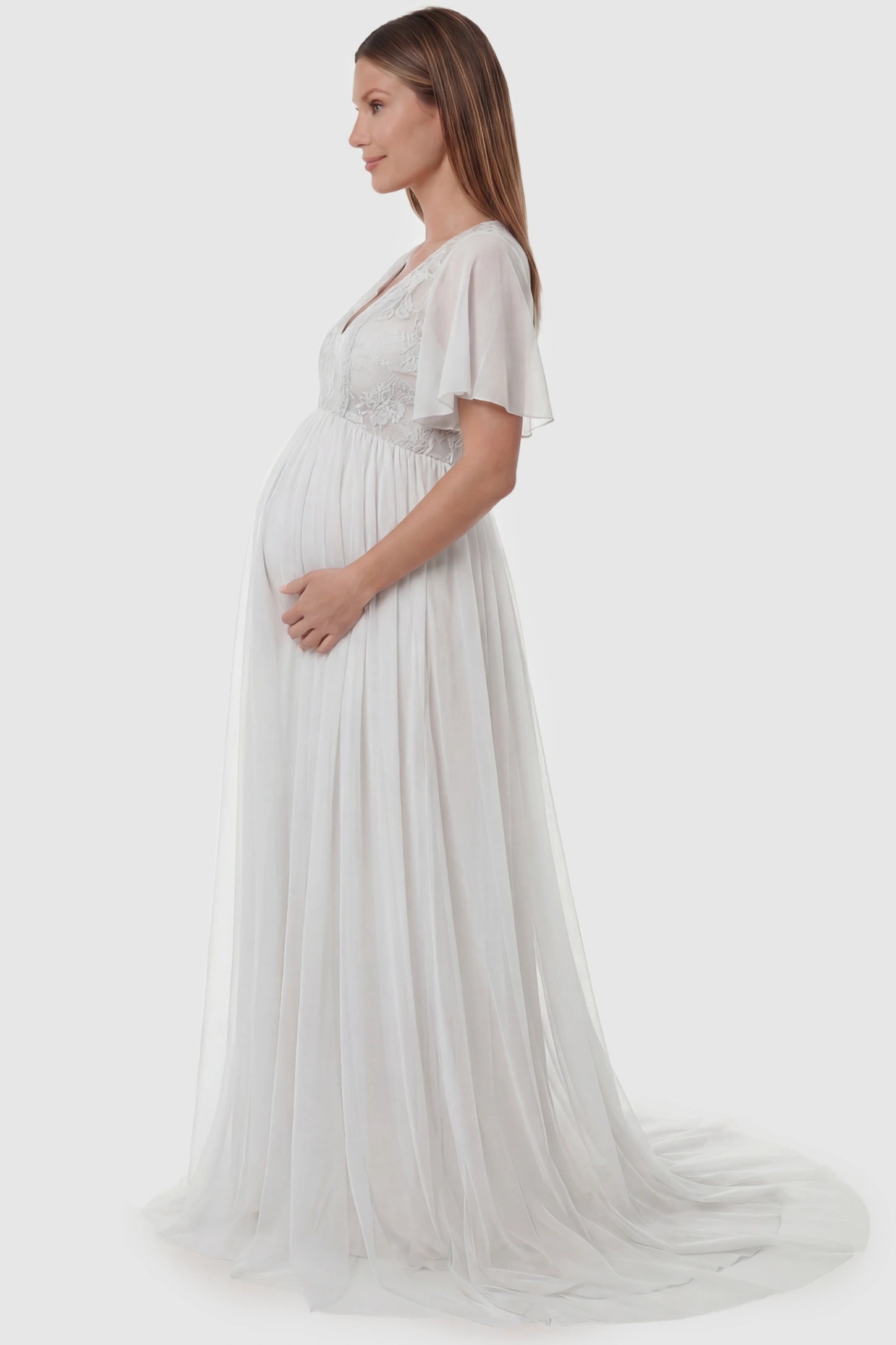 Lace Embroidered Short Flutter Sleeve Maxi Maternity Gown Lace embroidered short flutter sleeve maxi maternity gown in white featuring graceful long-train design in side view on a pregnant model