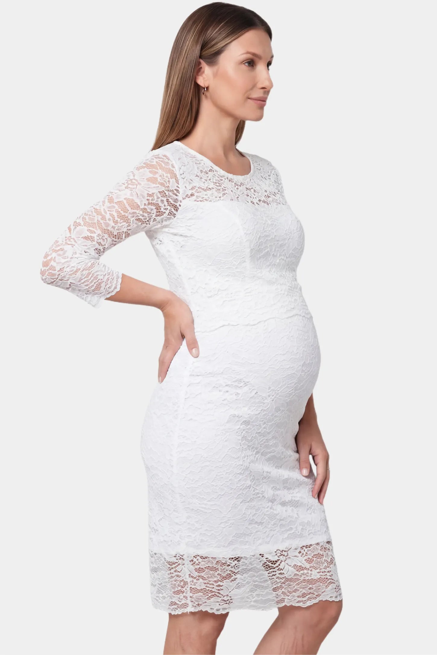Lace mid-length sleeve midi maternity and nursing dress in white featuring mid-length lace sleeve in side view on a pregnant model