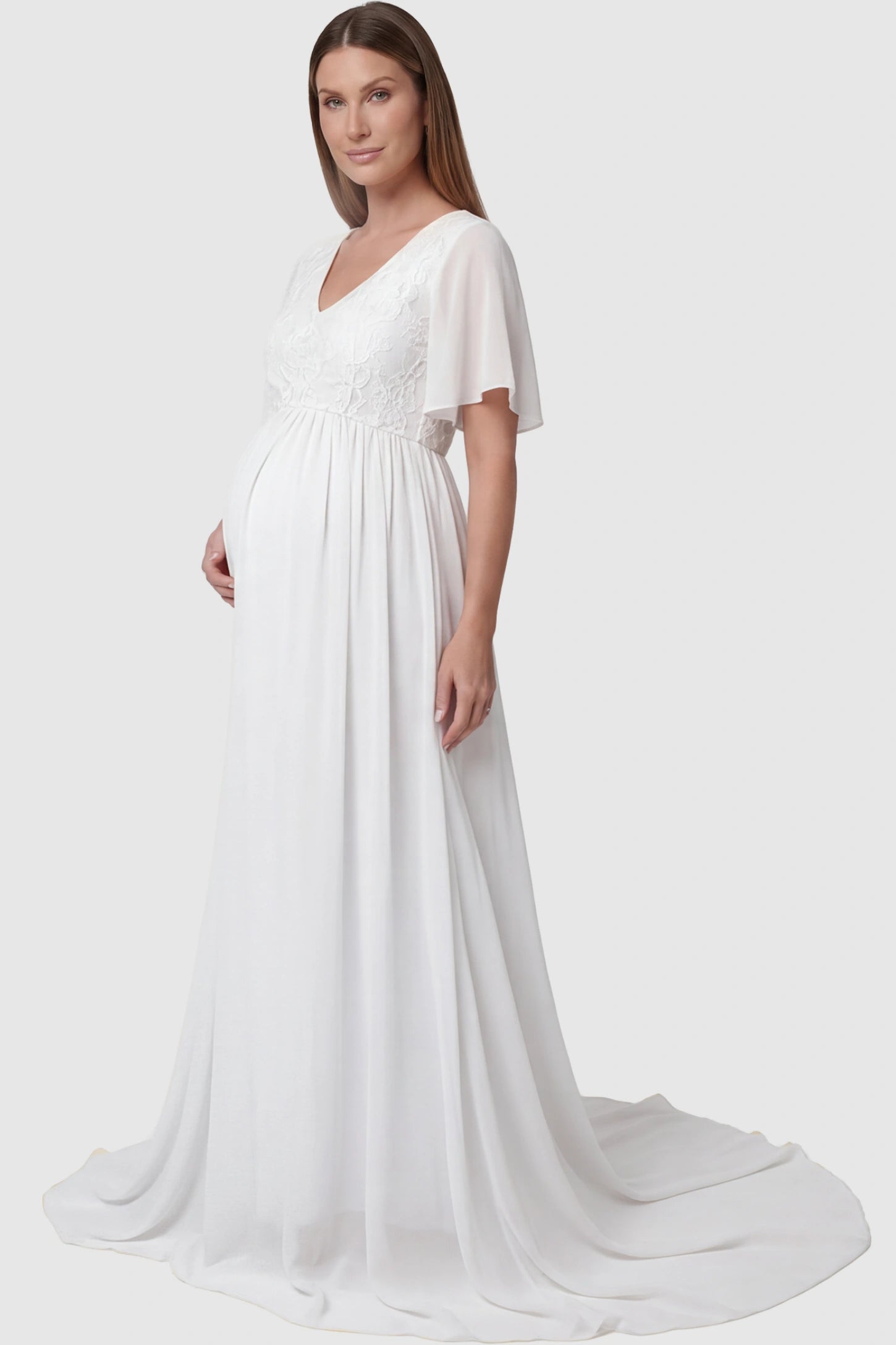 Lace Embroidered Short Flutter Sleeve Maternity Gown Lace embroidered short flutter sleeve maternity gown in white with delicate lace embroidery & flutter sleeves, side view on pregnant model