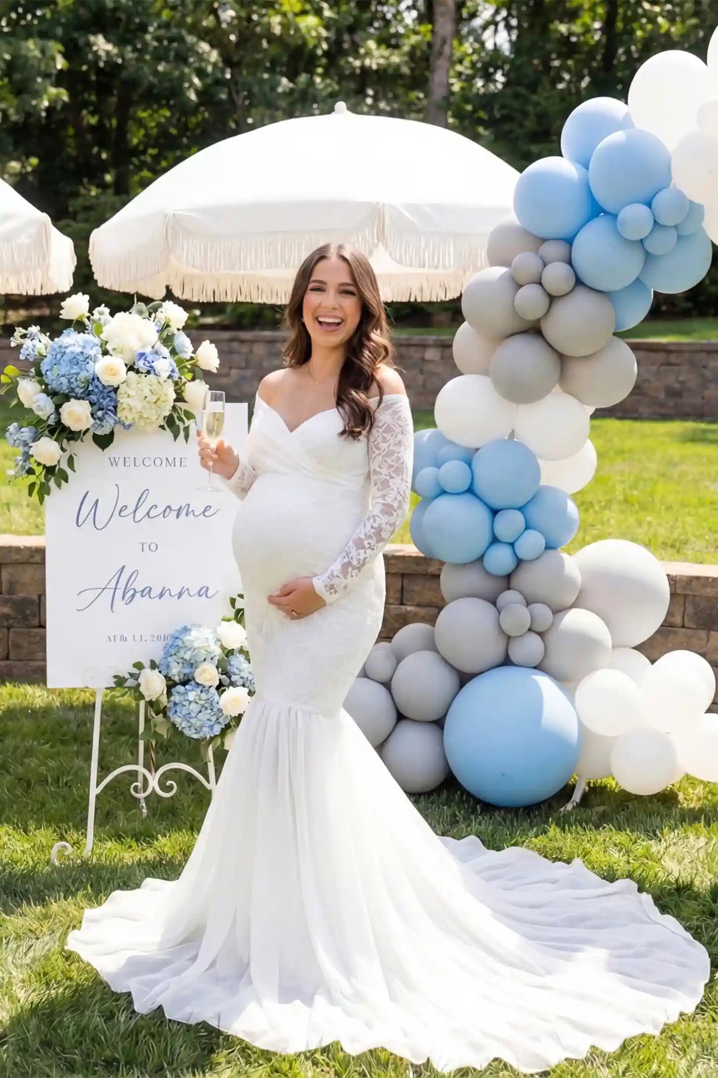 Lace-Spliced Off-Shoulder Long Sleeve Maxi Maternity Gown Lace-spliced off-shoulder long sleeve maxi maternity gown in white featuring lace long-sleeves and long-train in front view on a UGC model