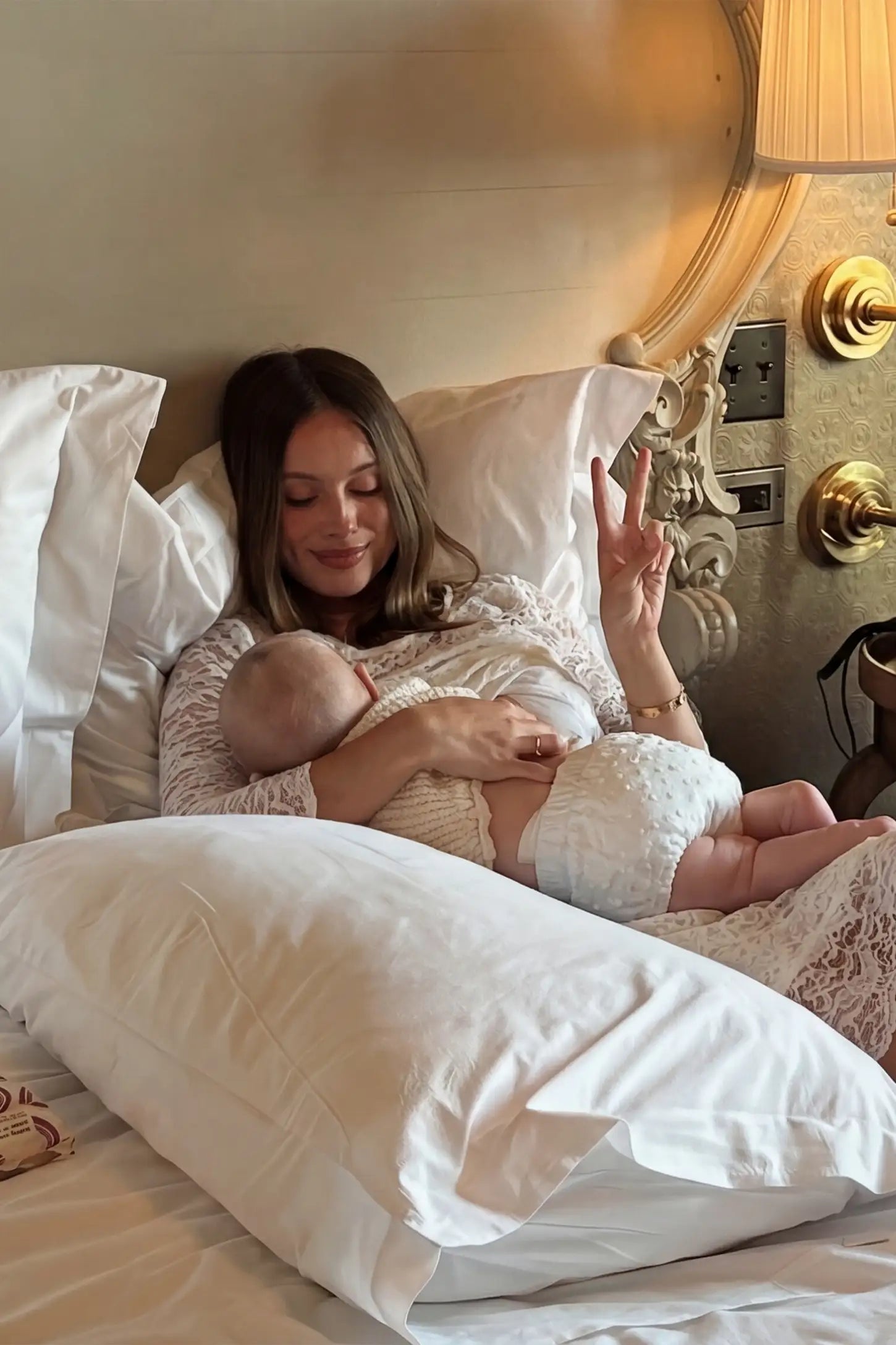 Lace Mid-Length Sleeve Midi Maternity & Nursing Dress Lace mid-length sleeve midi maternity and nursing dress in white featuring concealed nursing opening in front view on a UGC model