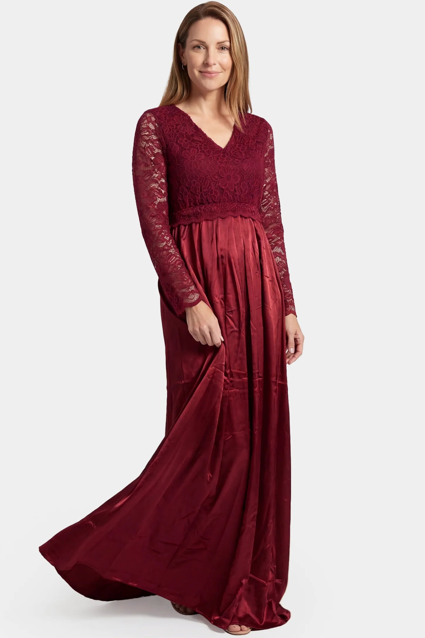 Lace-Spliced Silk Long Sleeve Maxi Maternity Dress Lace-spliced silk long sleeve maxi maternity dress in wine red featuring trailing skirt in full body front view on a postpartum model