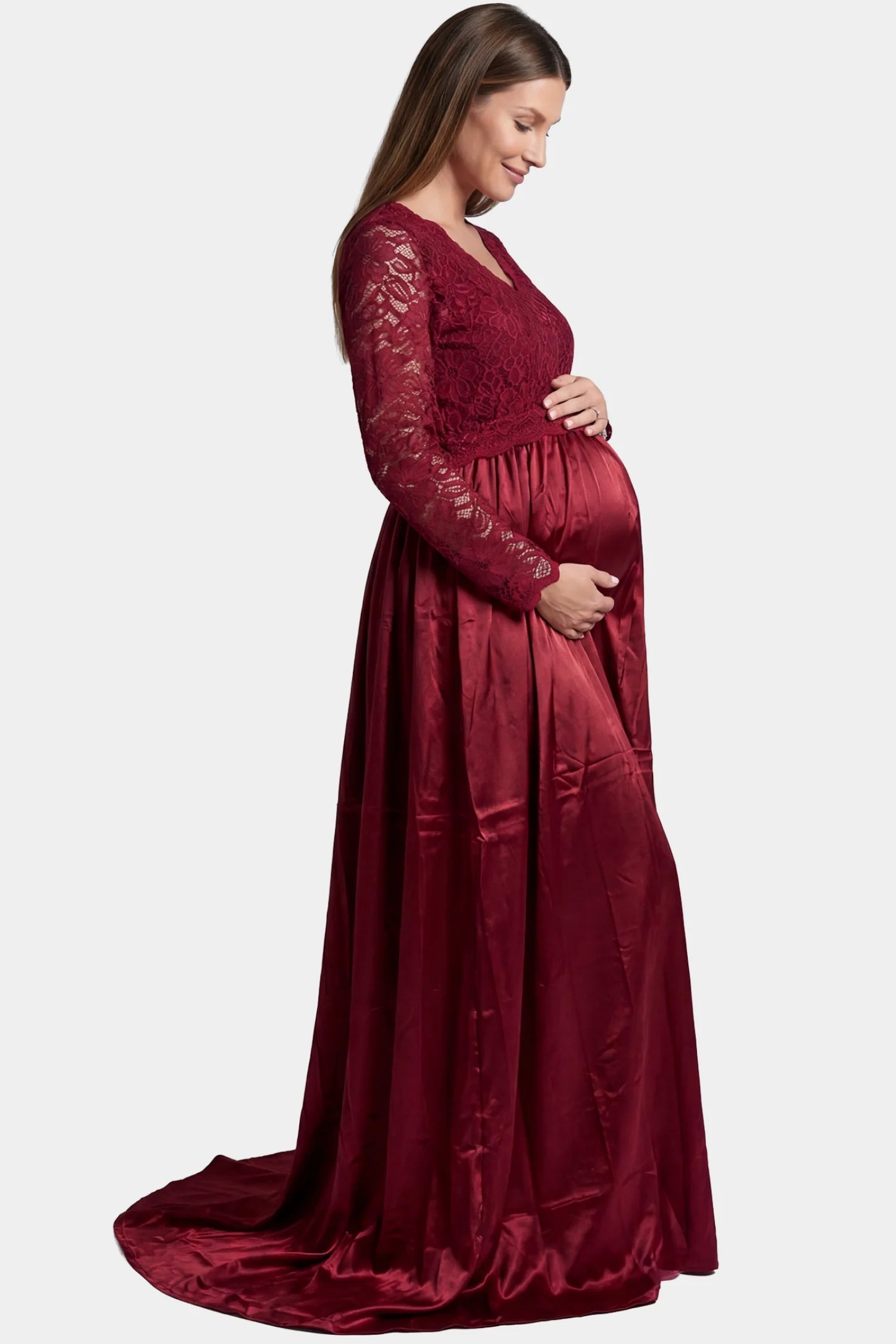 Lace-Spliced Silk Long Sleeve Maxi Maternity Dress Lace-spliced silk long sleeve maxi maternity dress in wine red featuring trailing skirt in full body side view on a pregnant model