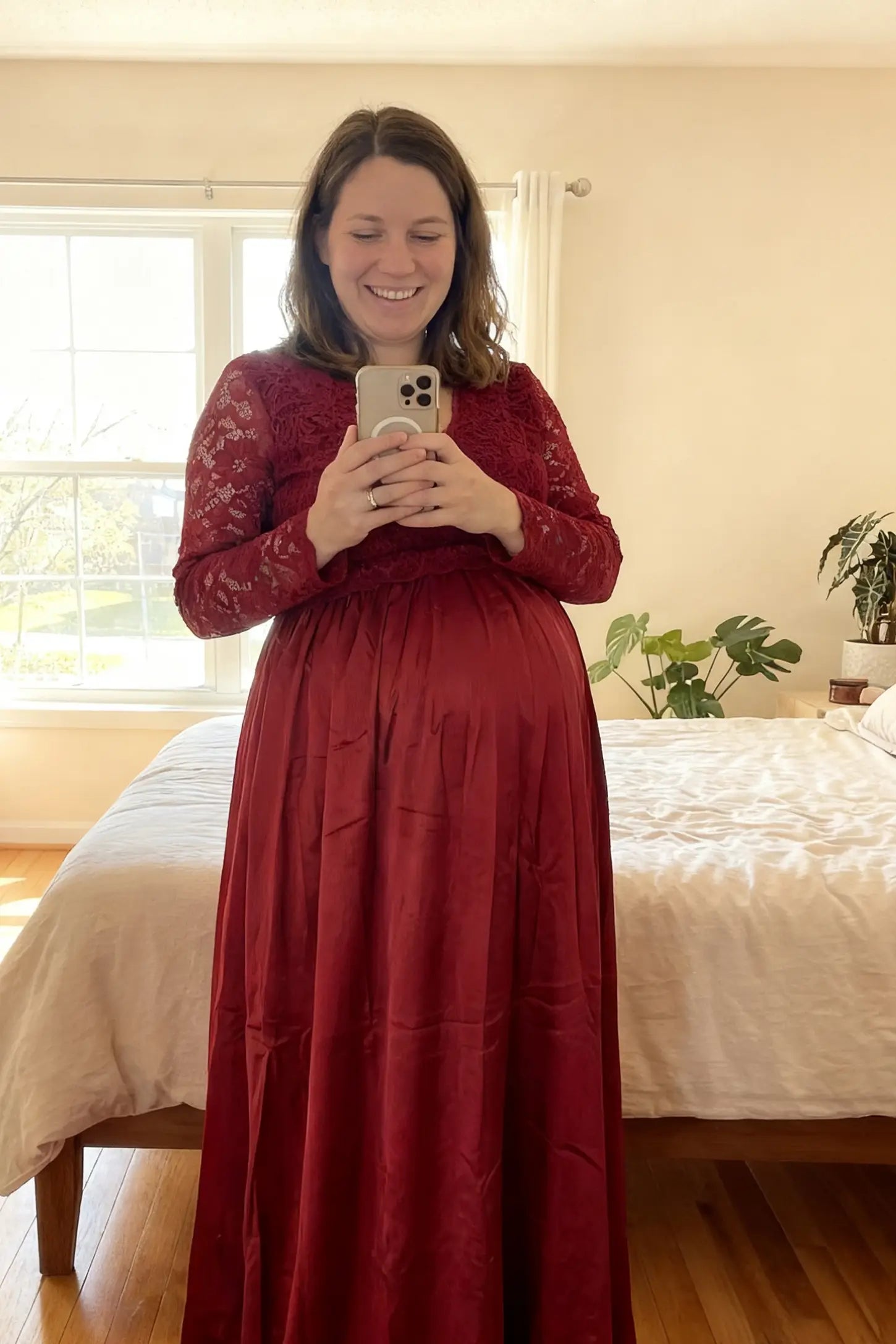 Lace-Spliced Silk Long Sleeve Maxi Maternity Dress Lace-spliced silk long sleeve maxi maternity dress in wine red featuring lace bodice and sleeves in front view on a UGC model