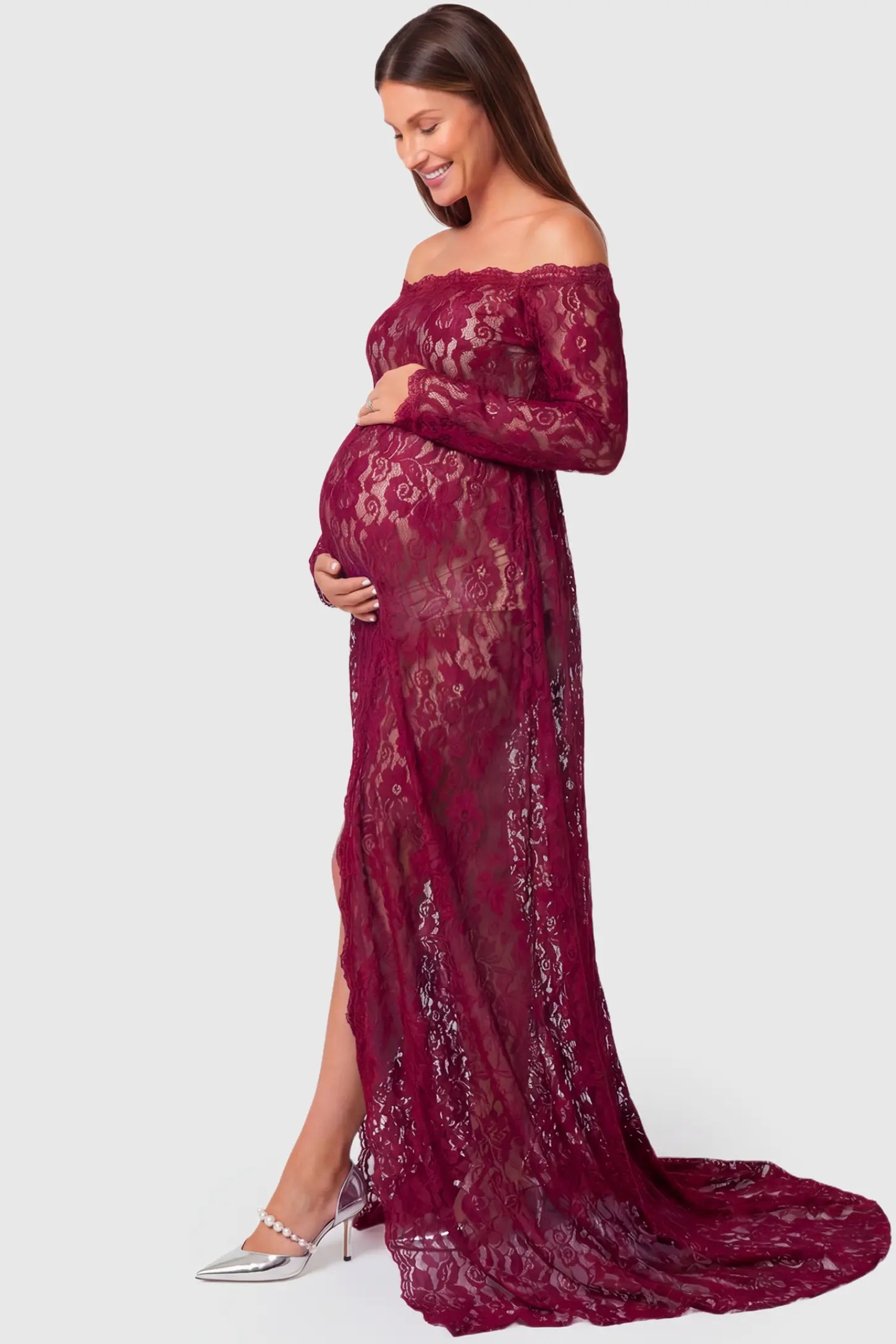 Lace Long Sleeve Maternity Gown Lace Long Sleeve Maternity Gown in burgundy featuring off-shoulder scalloped lace trim neckline and sweep train on pregnant model.