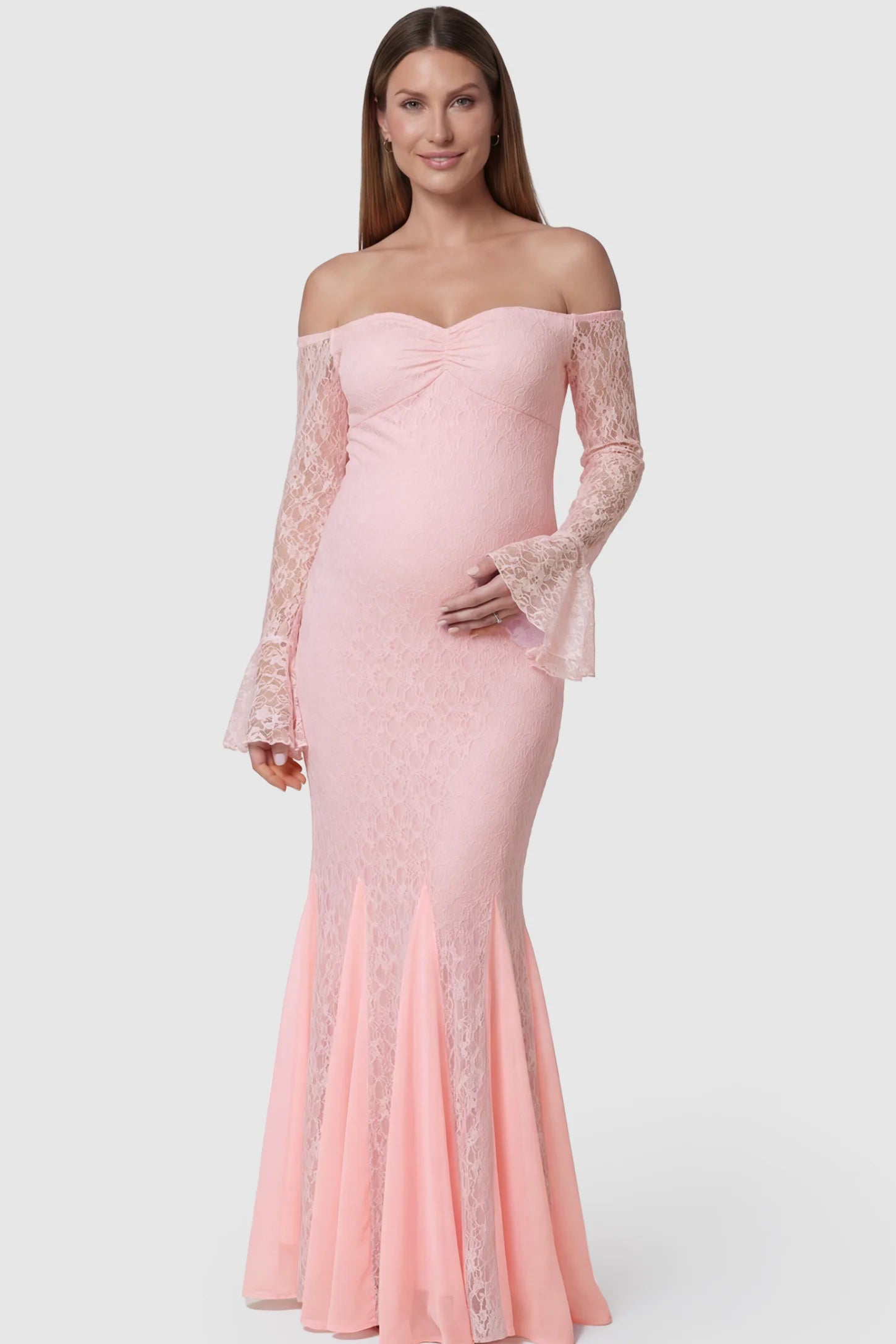 Lace Off Shoulder Mermaid Maternity Gown in pink lace featuring a sweetheart neckline, long sleeves, and a fitted mermaid silhouette on a pregnant model front view.