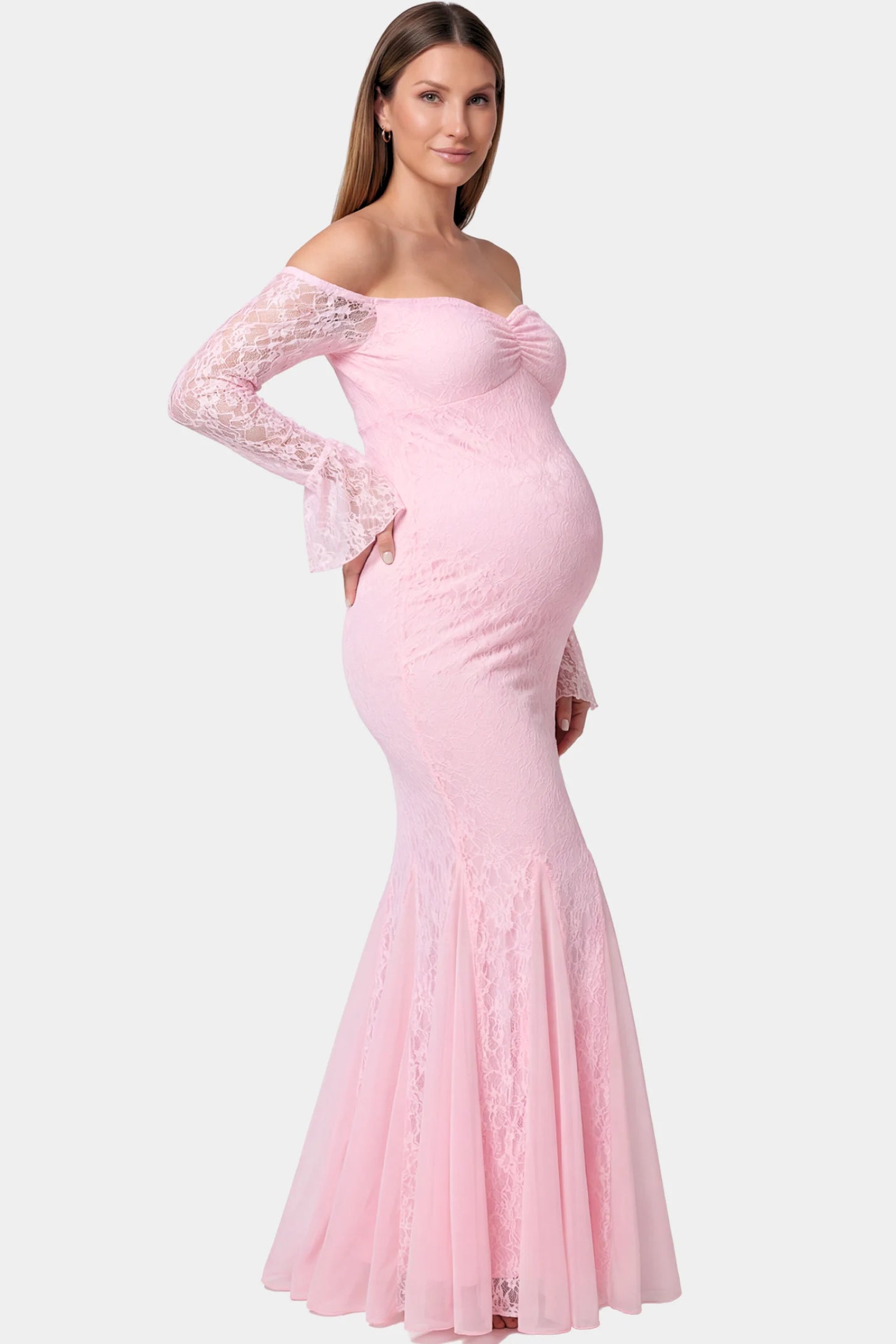 Lace Off Shoulder Mermaid Maternity Gown in pink lace featuring a sweetheart neckline, long sleeves, and a fitted mermaid silhouette on a pregnant model.