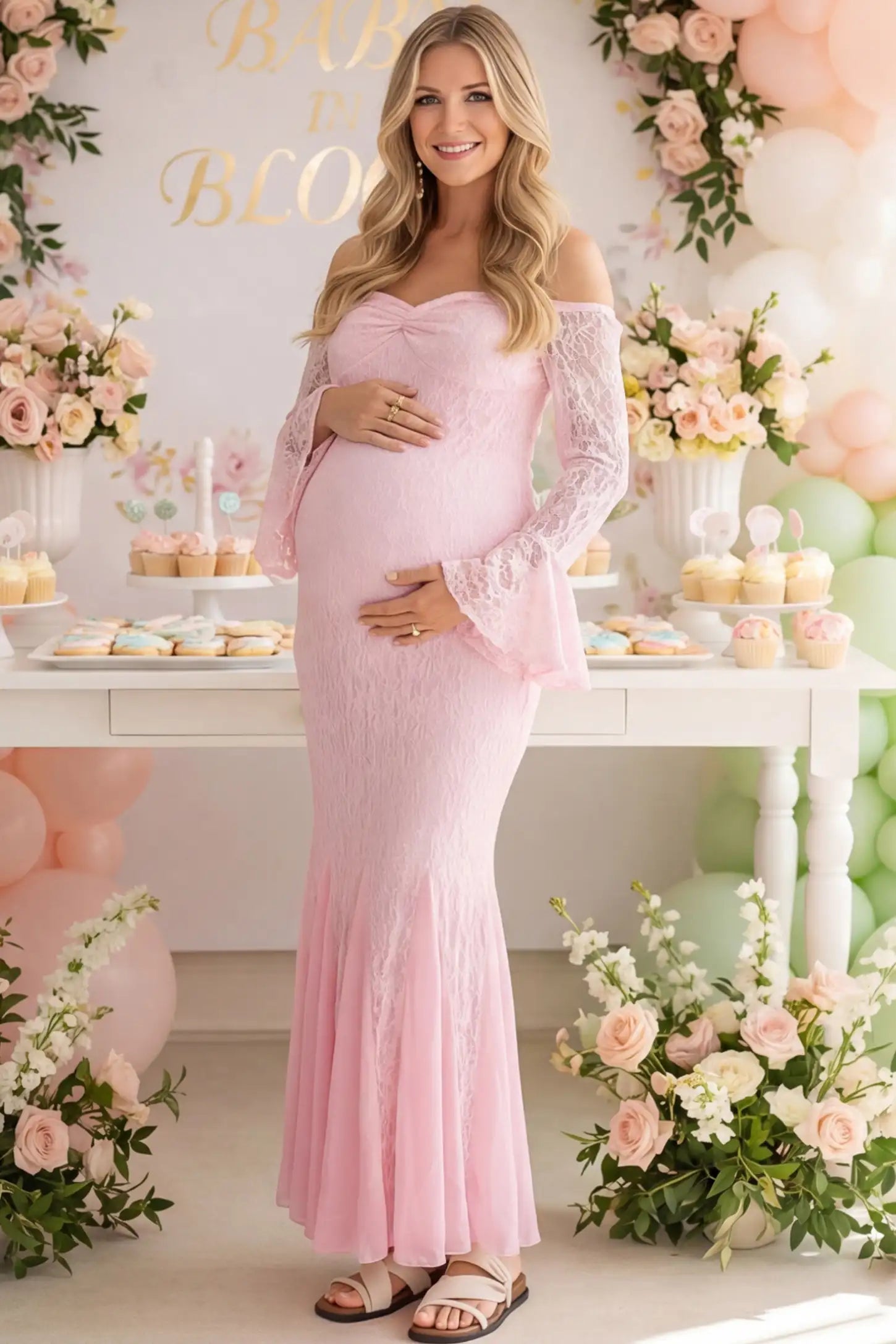 Lace Off Shoulder Mermaid Maternity Gown Lace Off Shoulder Mermaid Maternity Gown in pink lace featuring a sweetheart neckline, long sleeves, and a fitted mermaid silhouette on a pregnant woman in indoor setting front view.