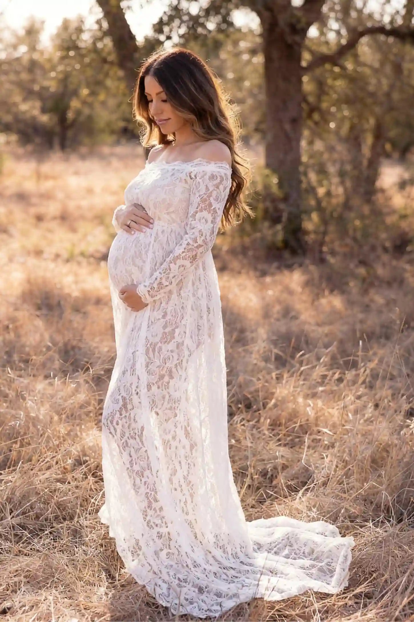Lace Long Sleeve Maternity Photoshoot Gown Lace Long Sleeve Maternity Gown in white featuring off-shoulder scalloped lace trim neckline and sweep train on pregnant model.