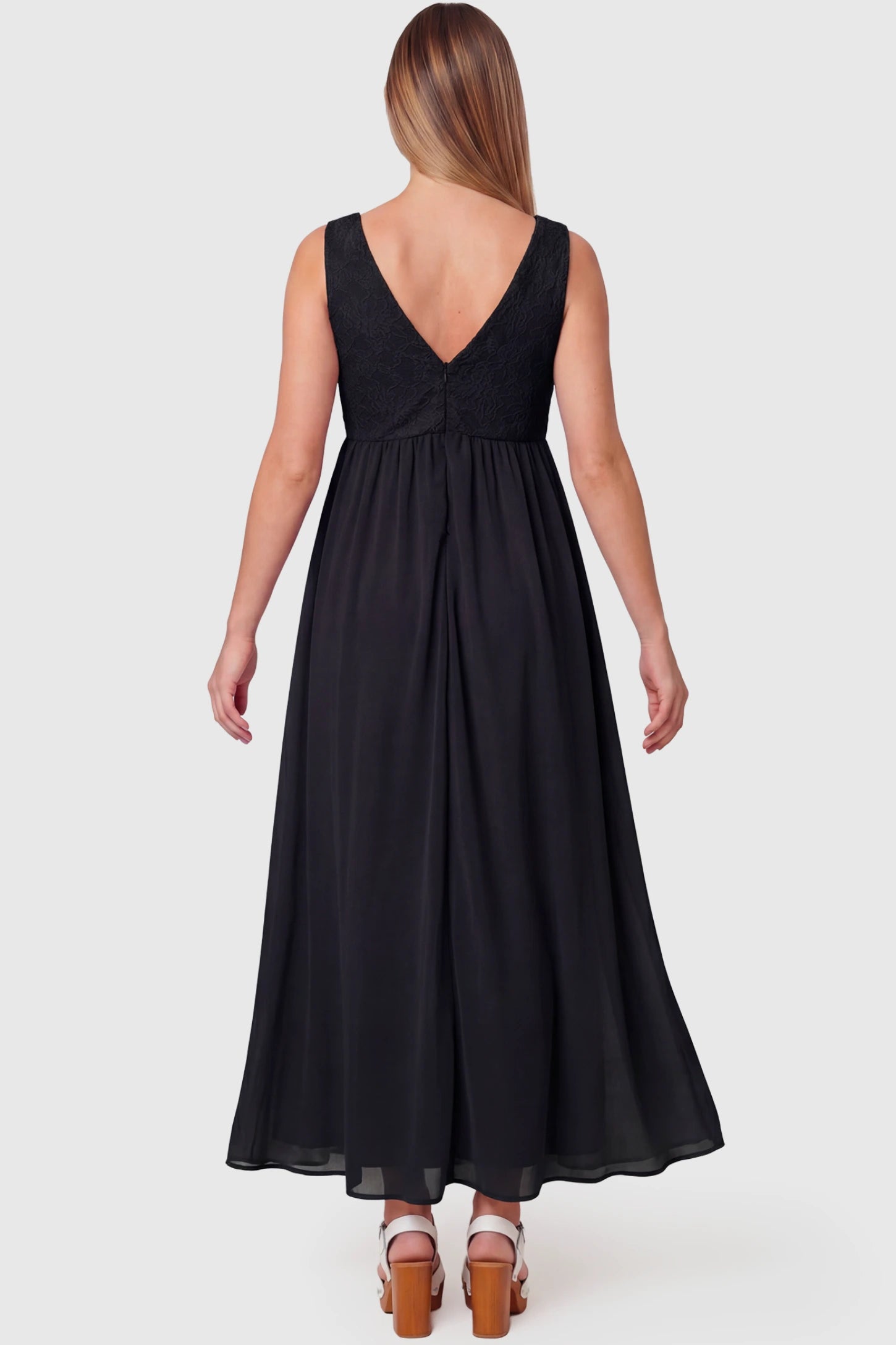 Lace Empire Waist Maternity Maxi Dress Lace Empire Waist Maternity Maxi Dress in black featuring V-back and flowing relaxed fit on pregnant model.