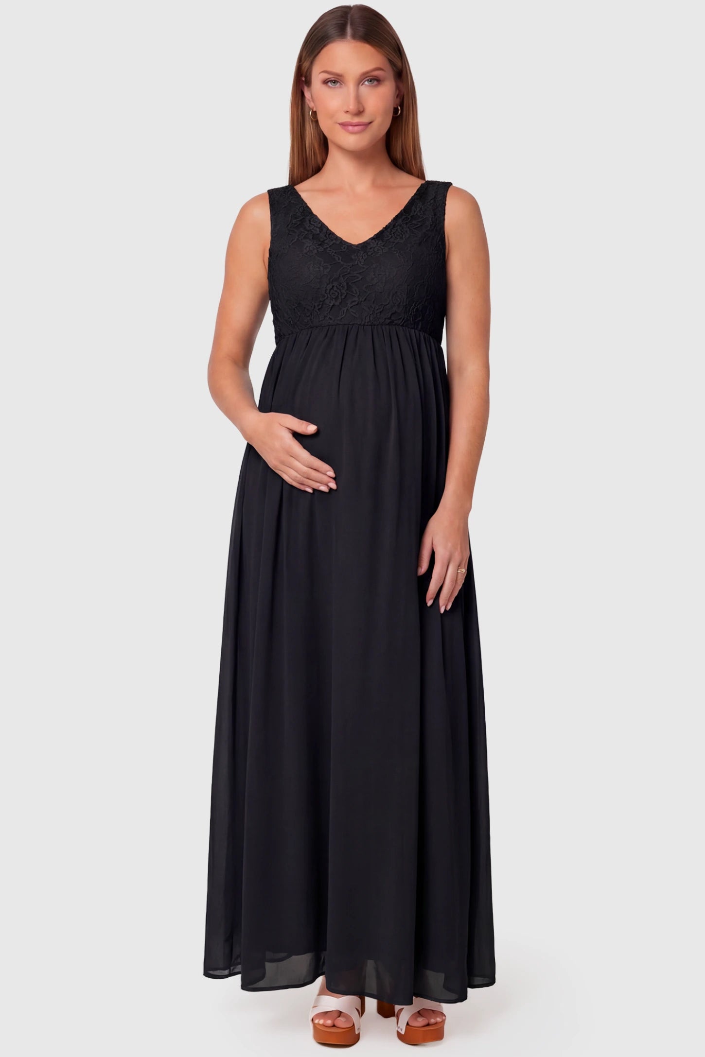 Lace Empire Waist Maternity Maxi Dress Lace Empire Waist Maternity Maxi Dress in black featuring V-neckline and flowing relaxed fit on pregnant model.