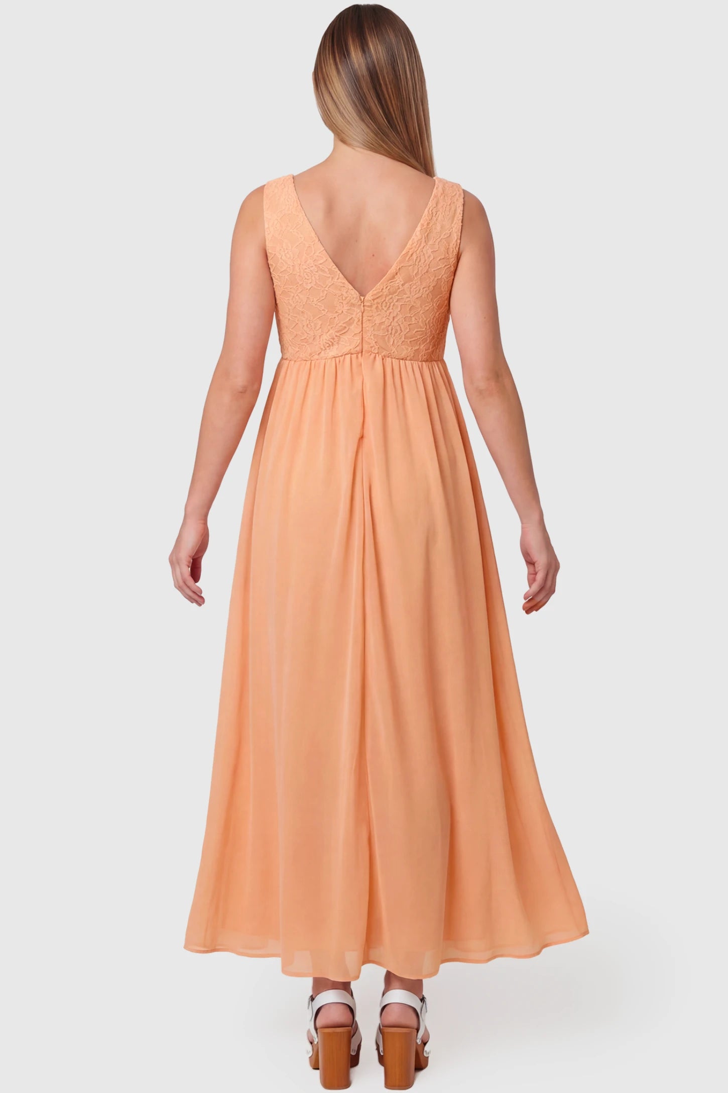 Lace Empire Waist Maternity Maxi Dress Lace Empire Waist Maternity Maxi Dress in pink featuring V-back and flowing relaxed fit on pregnant model.