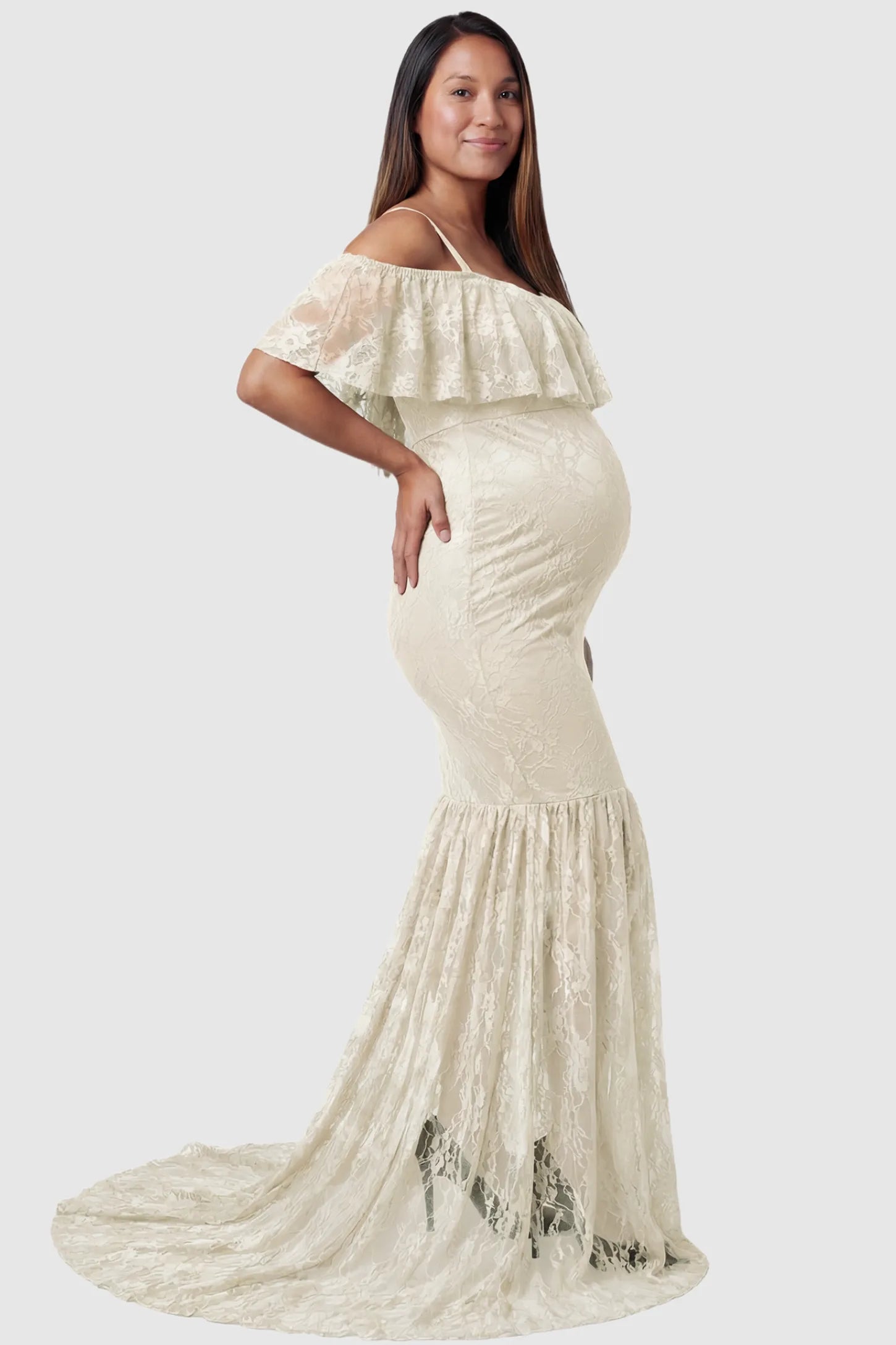 Lace Off-Shoulder Ruffle Short Sleeve Maternity Dress Lace off-shoulder maternity gown in apricot featuring ruffle neckline, mermaid silhouette, and extended lace train on pregnant model. side view