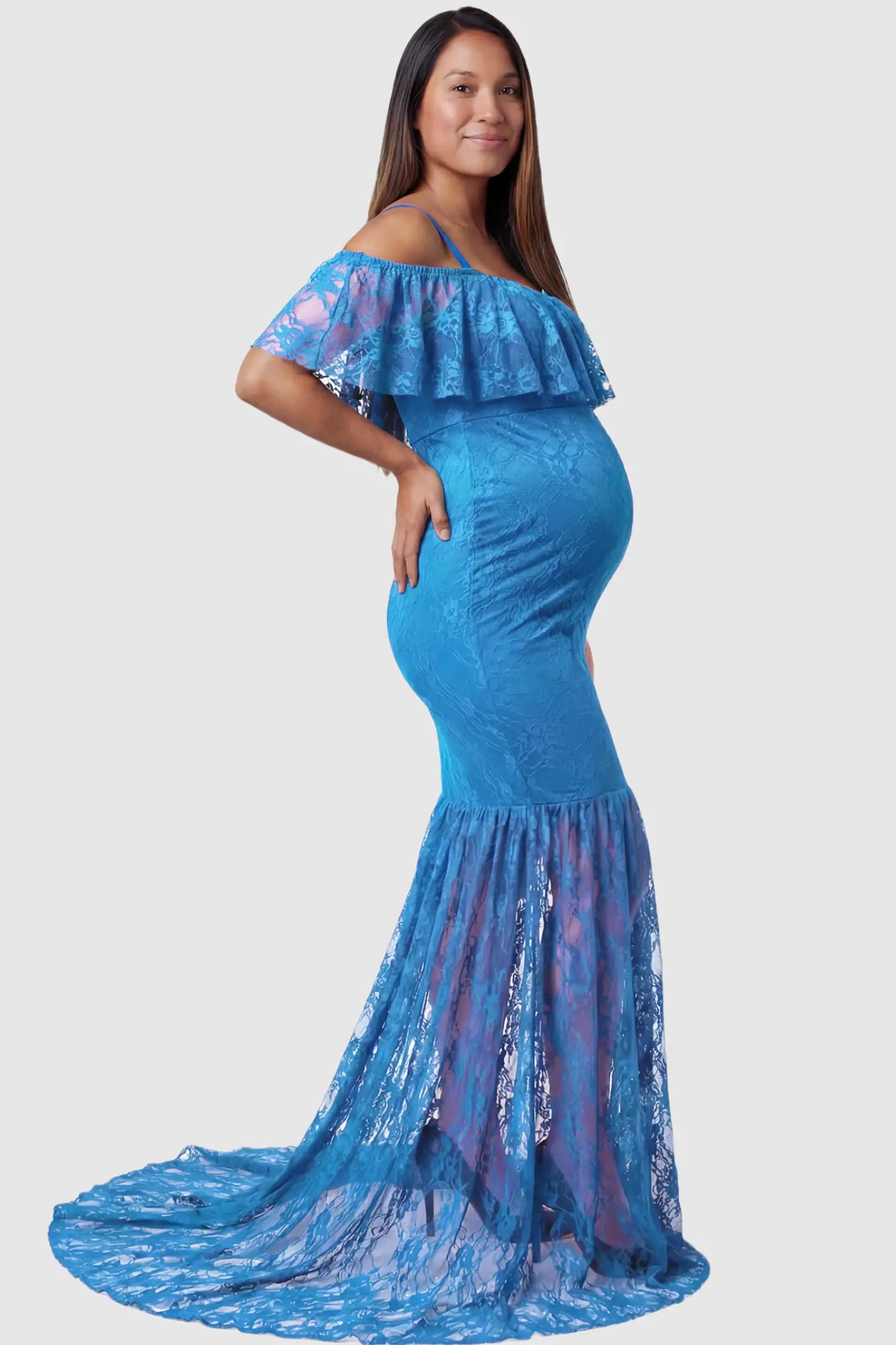 Lace Off-Shoulder Ruffle Short Sleeve Maternity Dress Lace off-shoulder maternity gown in lake blue featuring ruffle neckline, mermaid silhouette, and extended lace train on pregnant model. side view