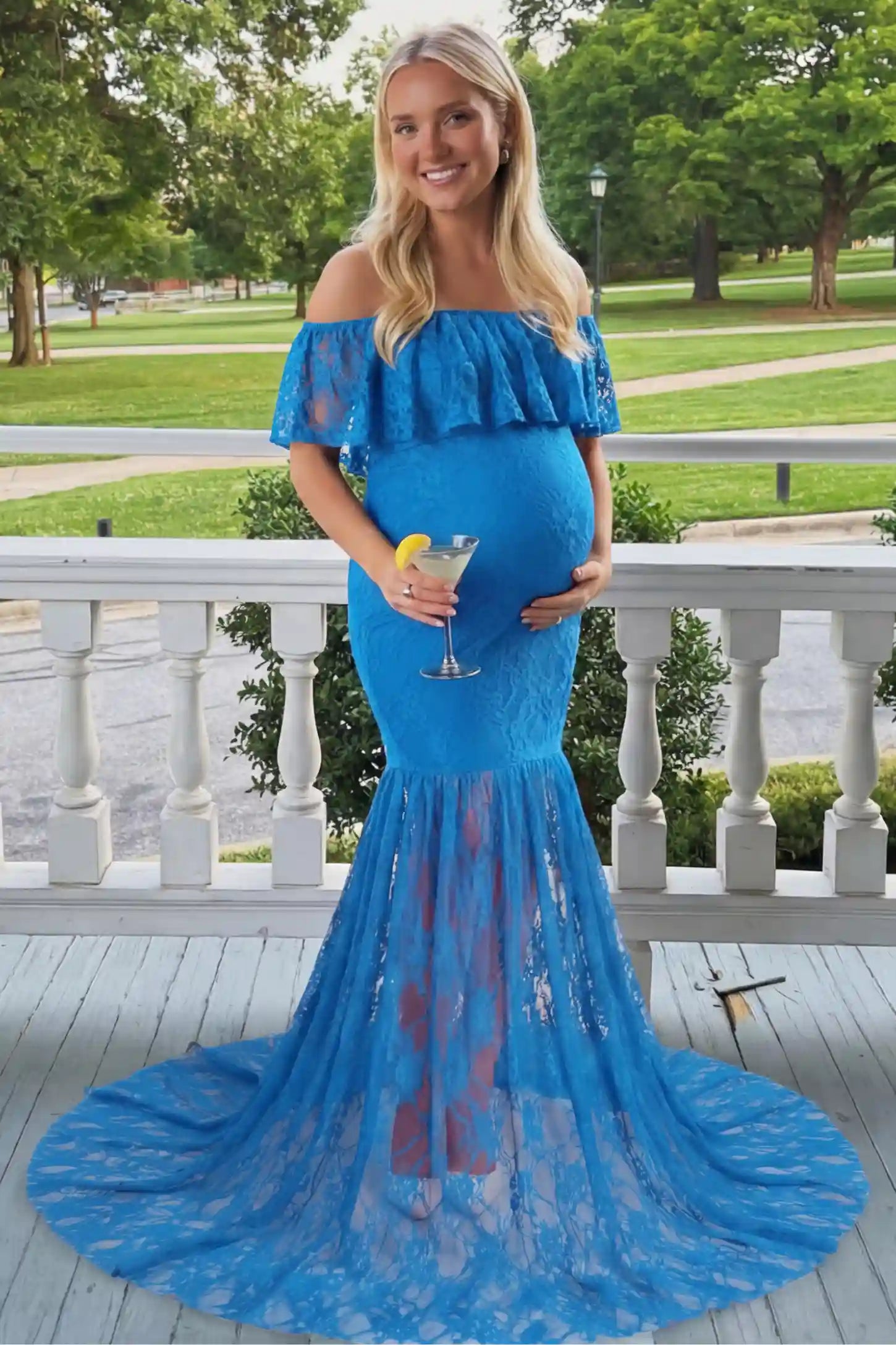Lace Off-Shoulder Ruffle Short Sleeve Maternity Dress Lace off-shoulder maternity gown in lake blue featuring ruffle neckline, mermaid silhouette, and extended lace train on pregnant model. 
