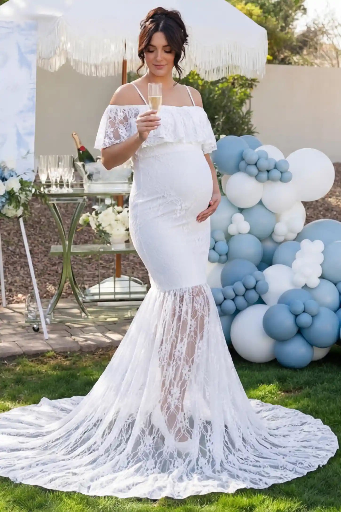 Lace Off-Shoulder Ruffle Short Sleeve Maternity Dress Lace off-shoulder maternity gown in white featuring ruffle neckline, mermaid silhouette, and extended lace train on pregnant model.