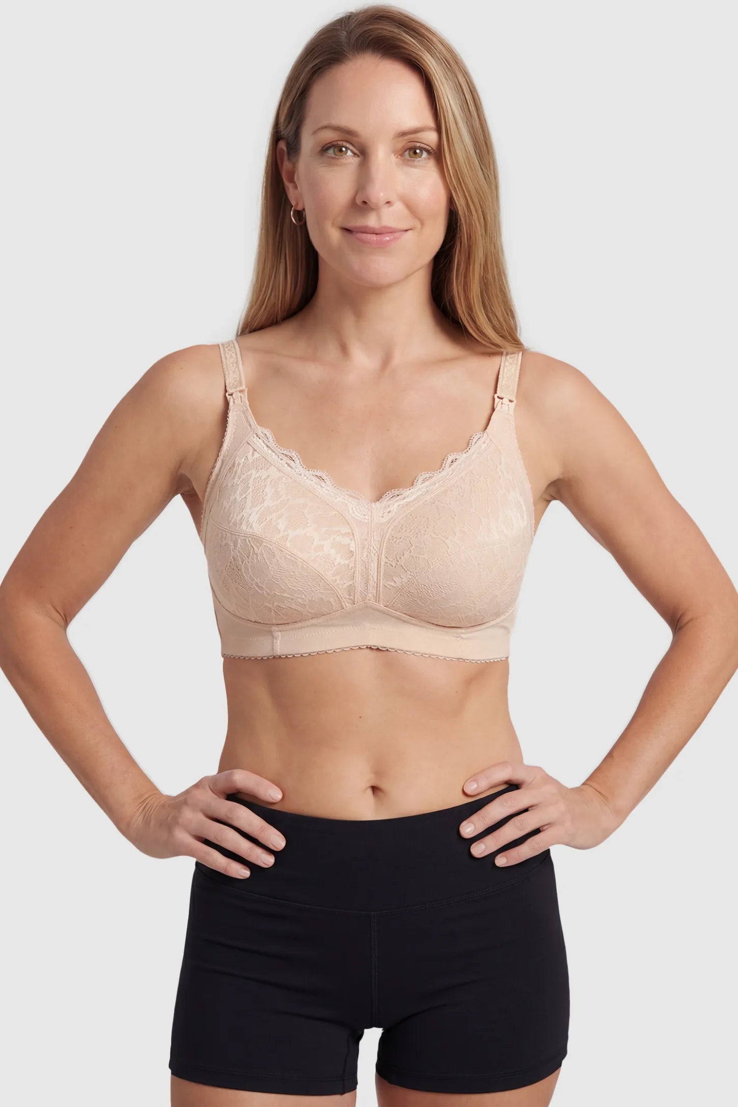 Wireless Lace Maternity Nursing Bra Wireless Lace Maternity Nursing Bra in beige featuring scalloped lace neckline, and full-cup coverage on non pregnant model.