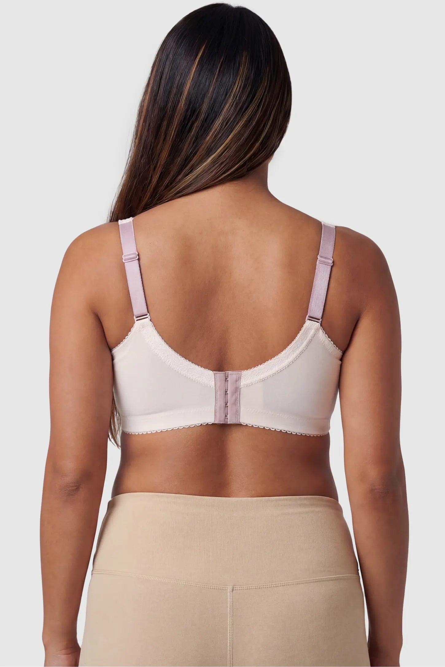 Wireless Lace Maternity Nursing Bra Wireless Lace Maternity Nursing Bra in beige featuring adjustable straps on pregnant model.
