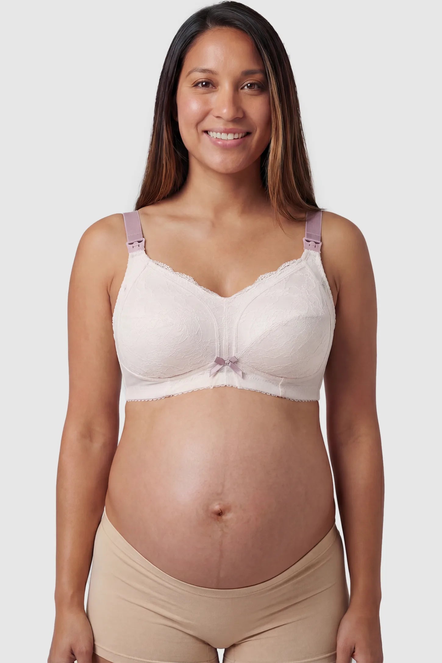 Wireless Lace Maternity Nursing Bra Wireless Lace Maternity Nursing Bra in white featuring scalloped lace neckline, and full-cup coverage on pregnant model.