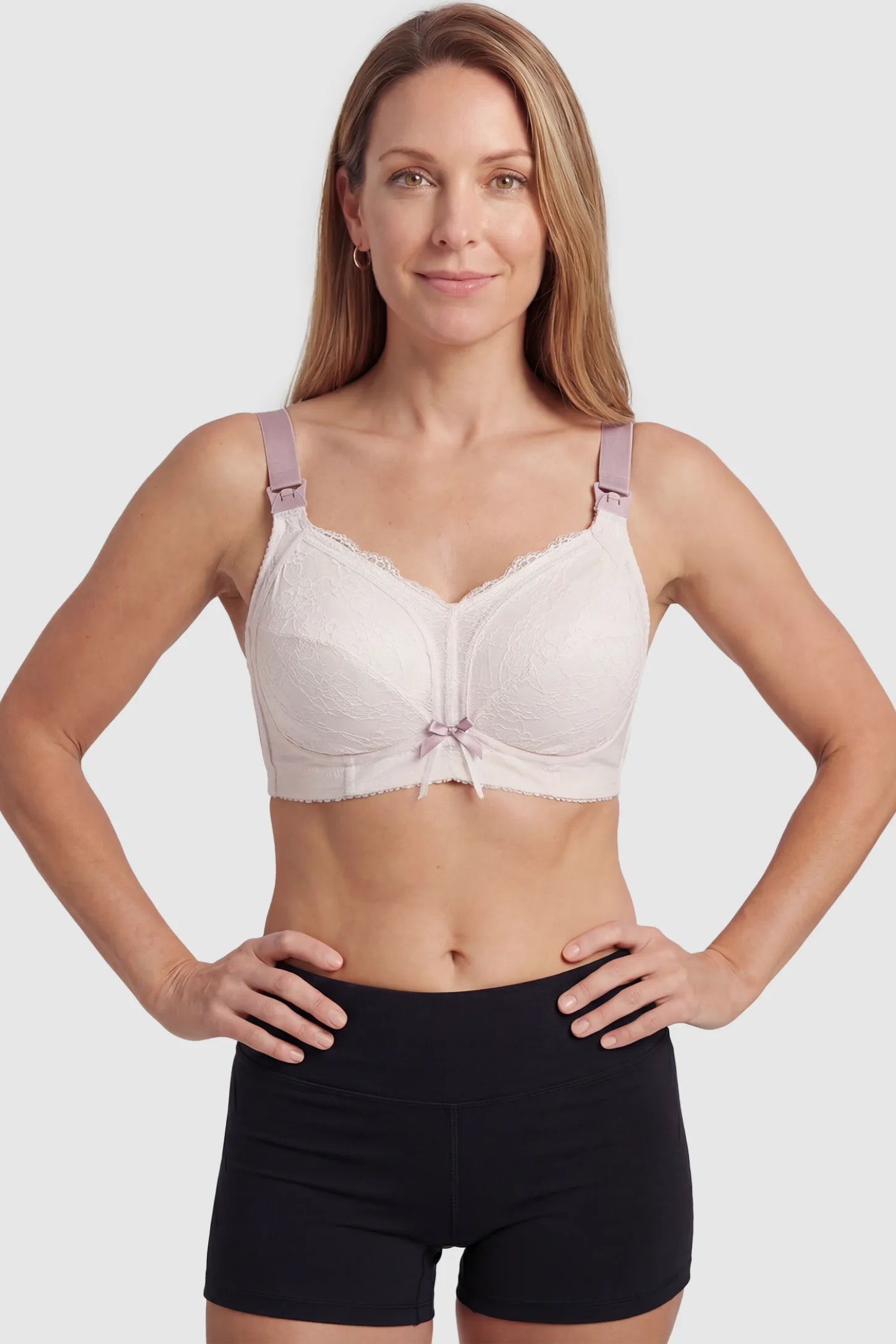 Wireless Lace Maternity Nursing Bra Wireless Lace Maternity Nursing Bra in white featuring scalloped lace neckline, full-cup coverage on non pregnant model.