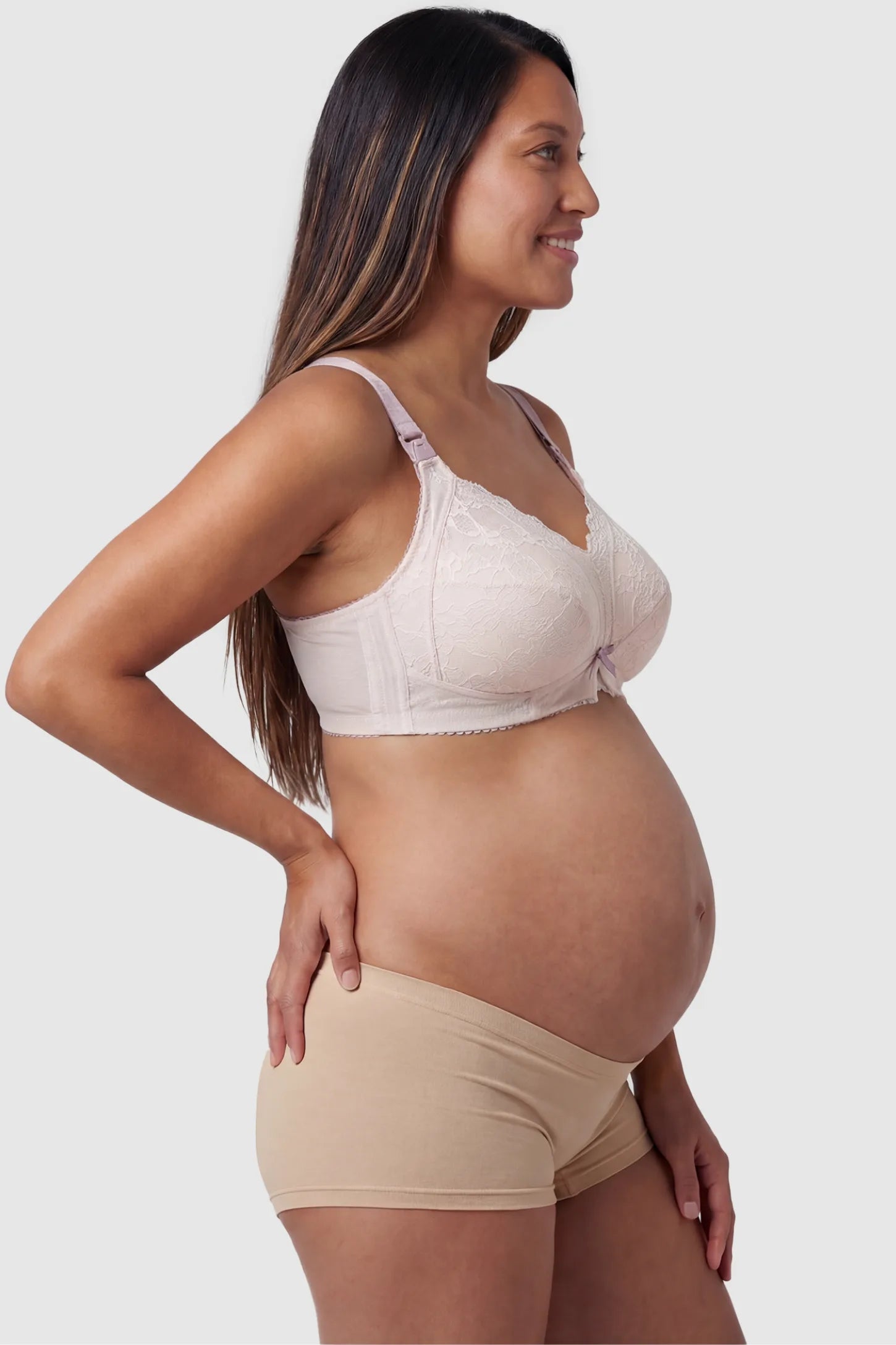 Wireless Lace Maternity Nursing Bra Wireless Lace Maternity Nursing Bra in white featuring scalloped lace neckline, and full-cup coverage on pregnant model.