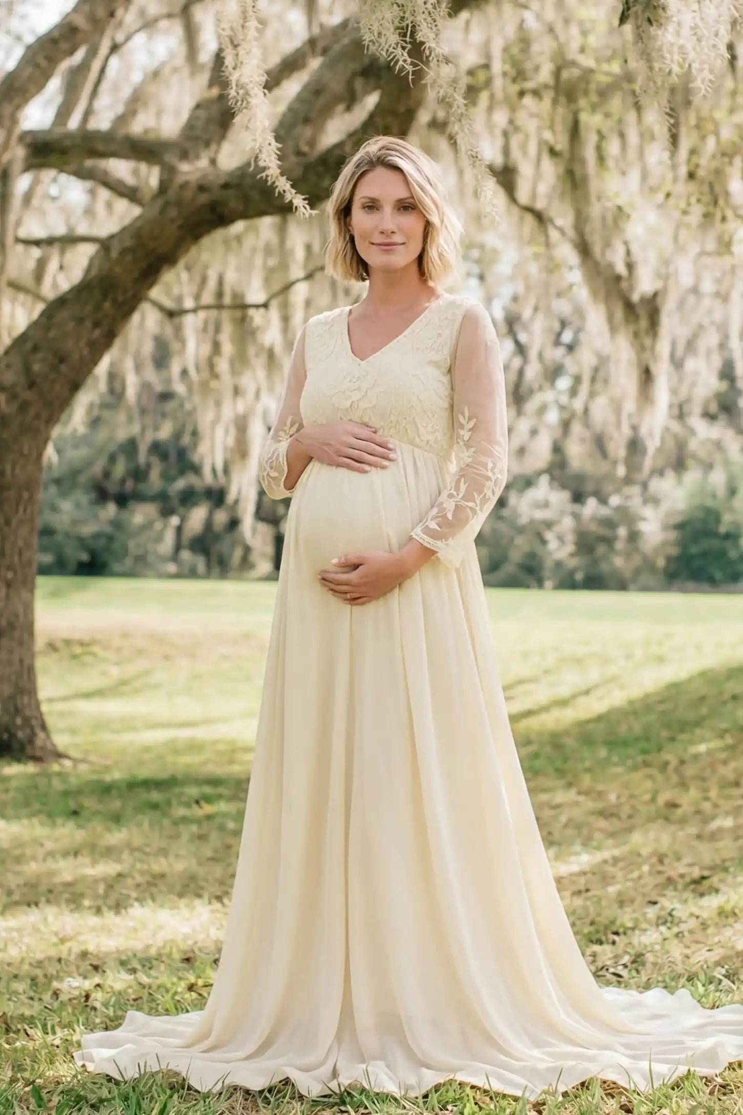 Lace Trim Long Sleeve Train Maternity Gown Lace trim long sleeve train maternity gown in apricot with flowing train silhouette & mesh sleeves, front view on pregnant model
