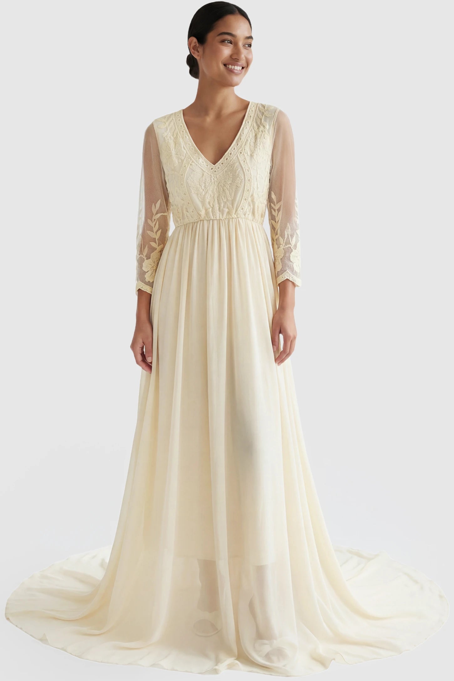 Lace Trim Long Sleeve Train Maternity Gown Lace trim long sleeve train maternity gown in apricot with flowing train silhouette & mesh sleeves, front view on postpartum model