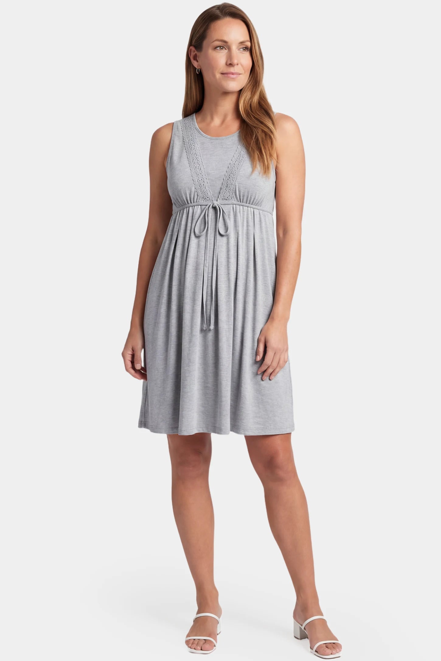 Sleeveless Round Neck Tie-Front Short Maternity & Nursing Dress Sleeveless round neck tie-front short maternity and nursing dress in gray featuring sleeveless cut and tie-front in full body view on a postpartum model