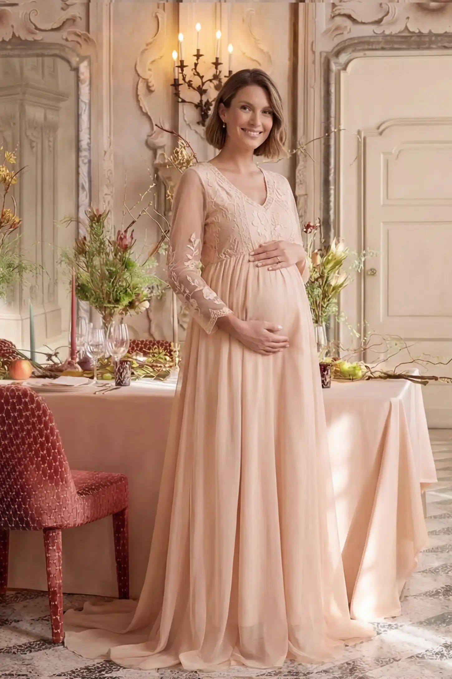 Lace Trim Long Sleeve Train Maternity Gown Lace trim long sleeve train maternity gown in pink with flowing train silhouette & mesh sleeves, front view on pregnant model