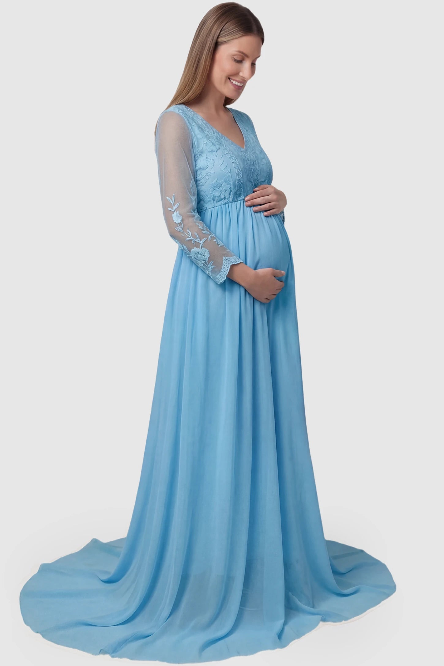 Lace Trim Long Sleeve Train Maternity Gown Lace trim long sleeve train maternity gown in sky blue with flowing train silhouette & mesh sleeves, side view on pregnant model