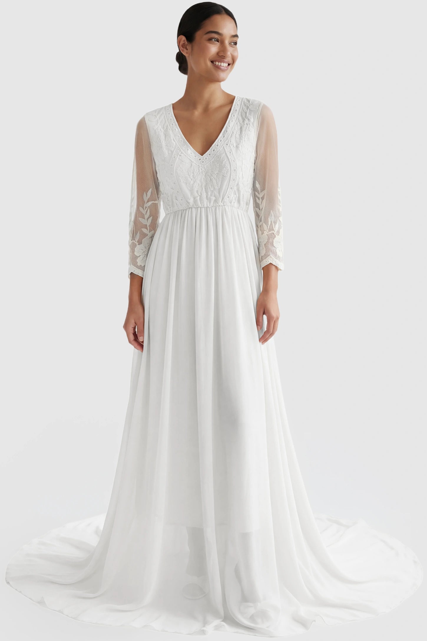 Lace Trim Long Sleeve Train Maternity Gown Lace trim long sleeve train maternity gown in white with flowing train silhouette & mesh sleeves, front view on postpartum model