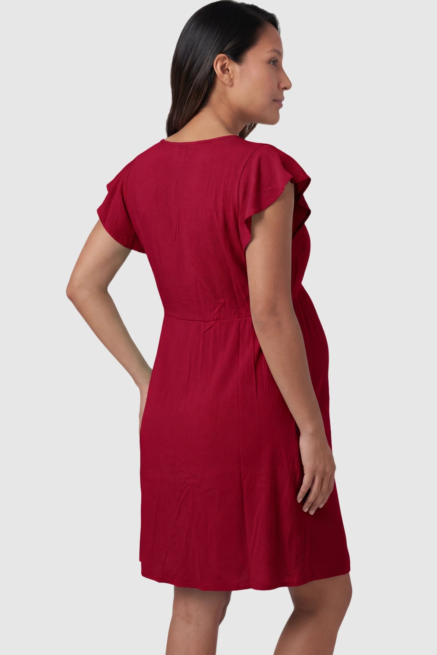 Lace Trim V-Neck Maternity & Nursing Sleep Dress Lace trim V-neck maternity nursing sleep dress in burgundy with empire waist and relaxed A-line fit on pregnant model back view.