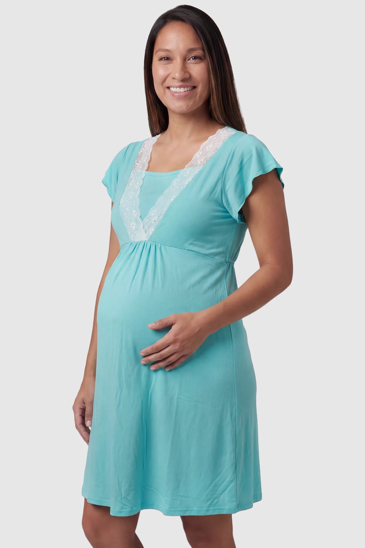 Lace Trim V-Neck Maternity & Nursing Sleep Dress Lace trim V-neck maternity nursing sleep dress in light blue with empire waist and relaxed A-line fit on pregnant model front view.
