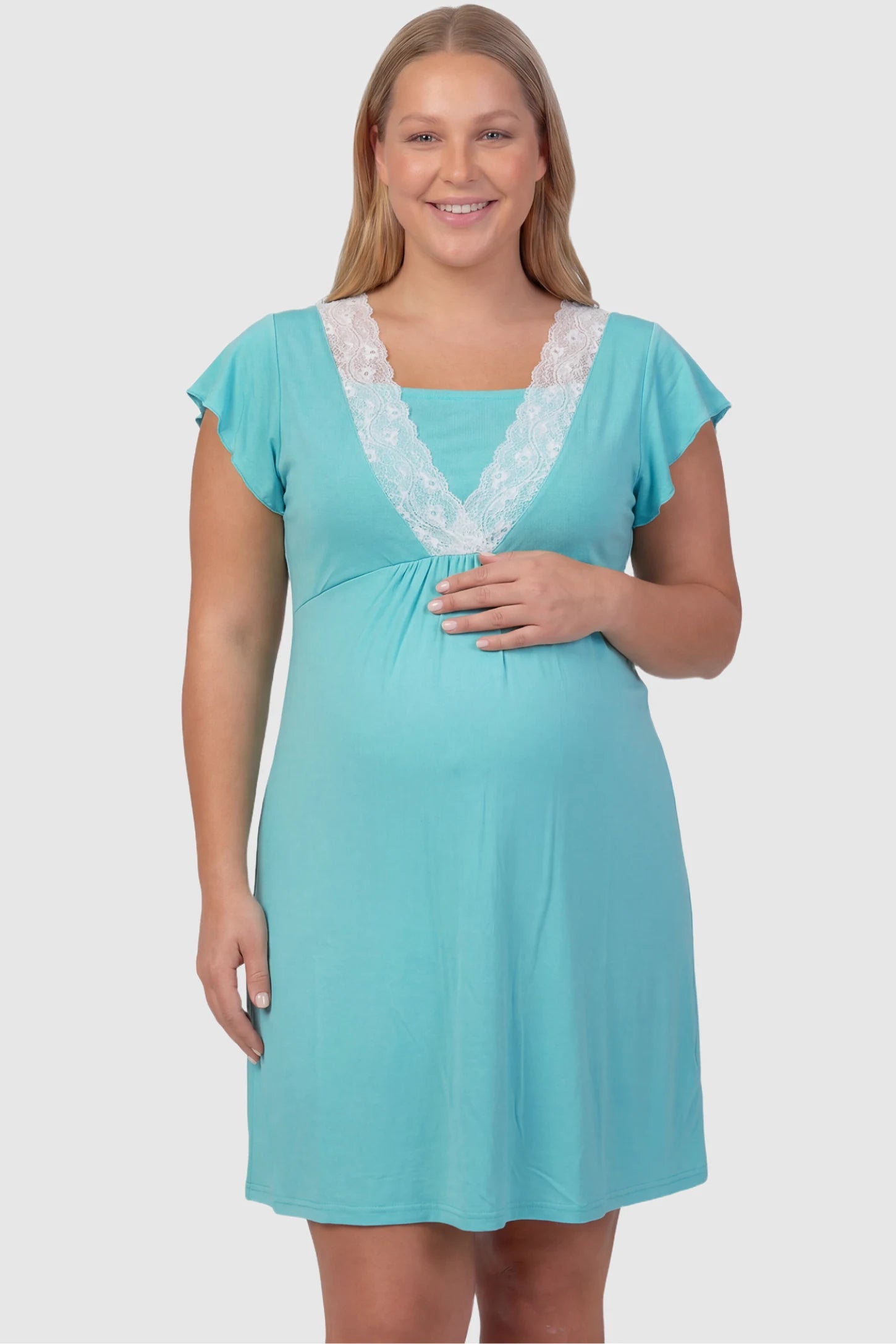 Lace Trim V-Neck Maternity & Nursing Sleep Dress Lace trim V-neck maternity nursing sleep dress in light blue with empire waist and relaxed A-line fit on plus size pregnant model front view.
