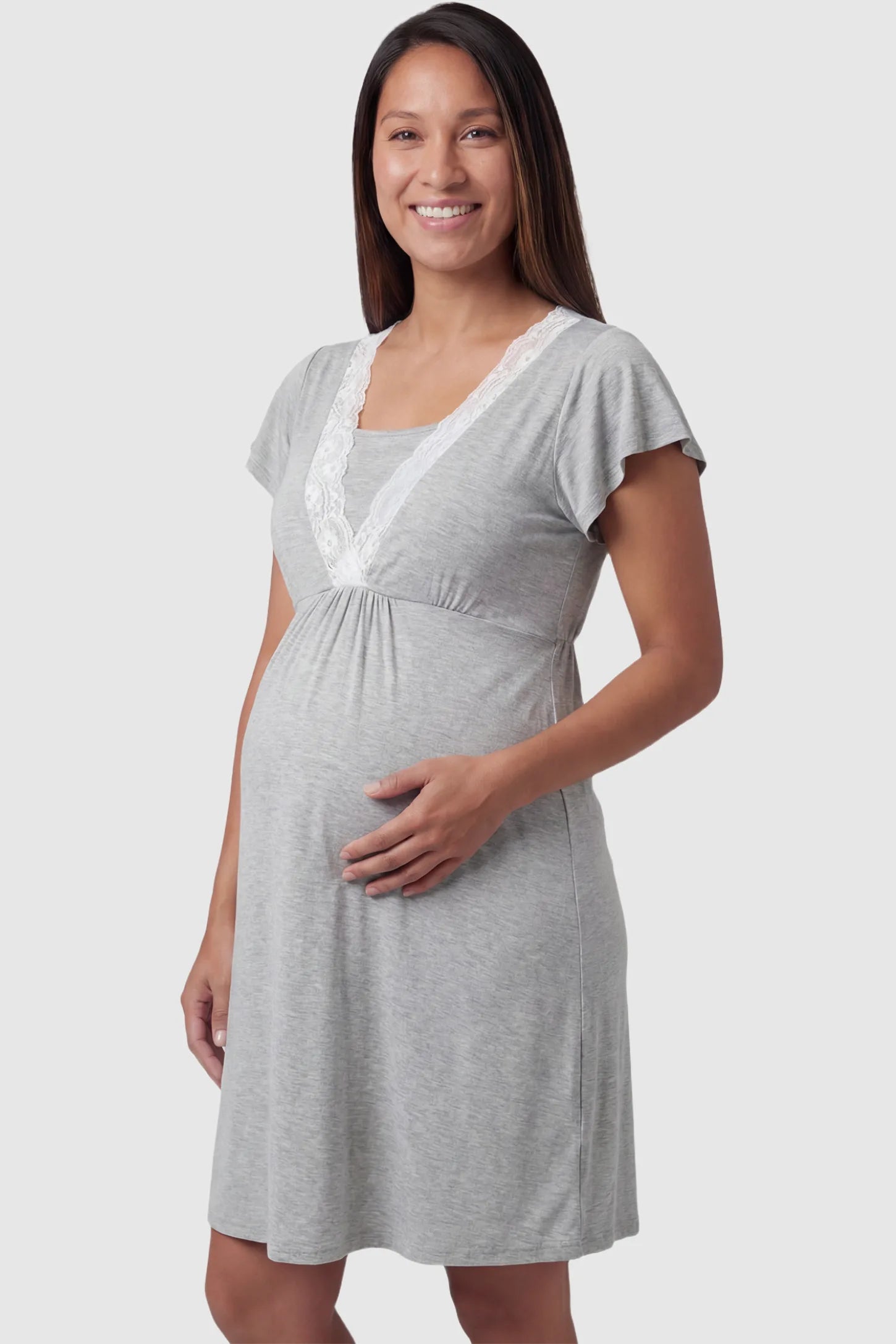 Lace Trim V-Neck Maternity & Nursing Sleep Dress Lace trim V-neck maternity nursing sleep dress in light gray with empire waist and relaxed A-line fit on pregnant model front view.