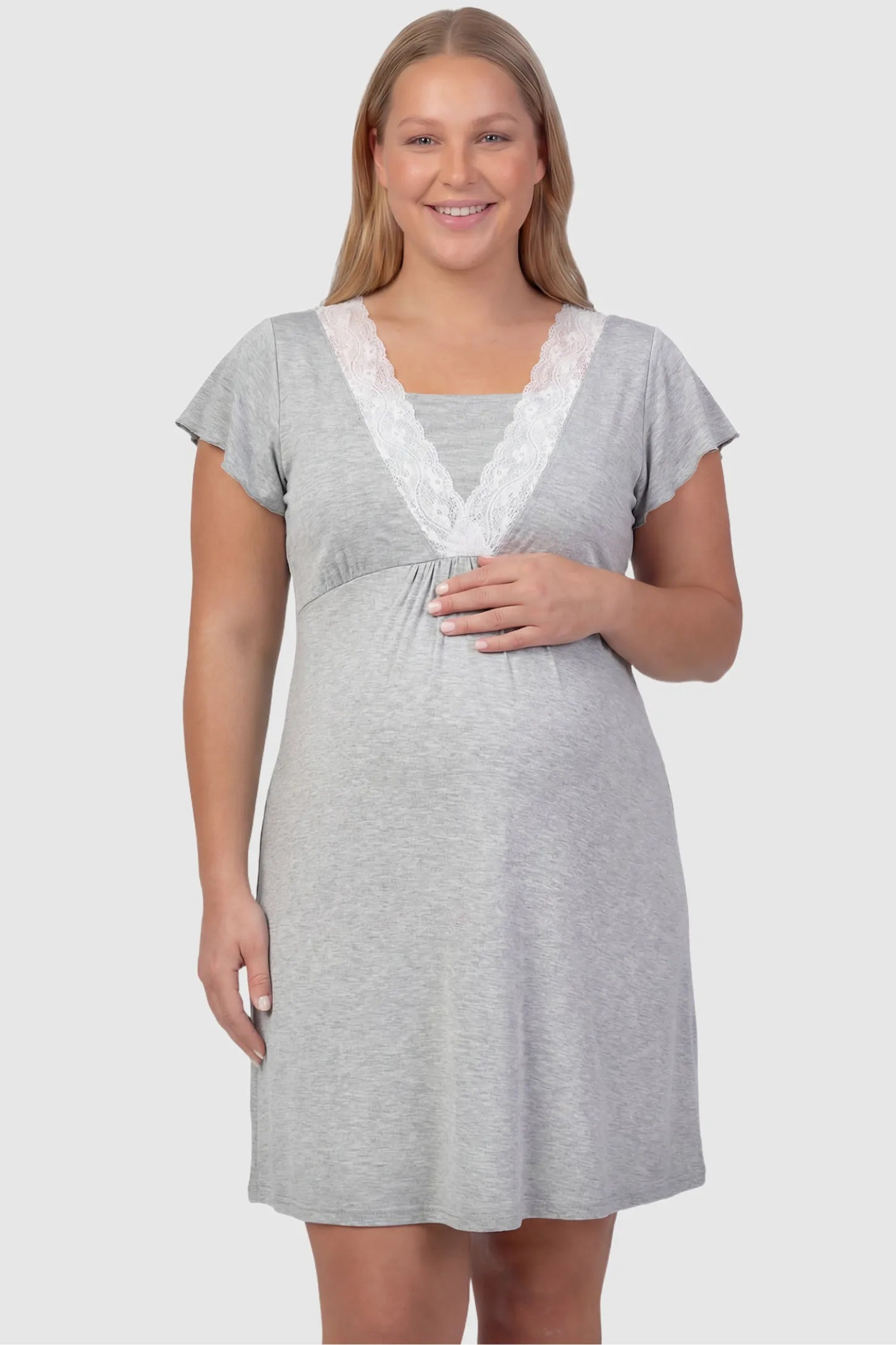 Lace Trim V-Neck Maternity & Nursing Sleep Dress Lace trim V-neck maternity nursing sleep dress in light gray with empire waist and relaxed A-line fit on plus size pregnant model front view.