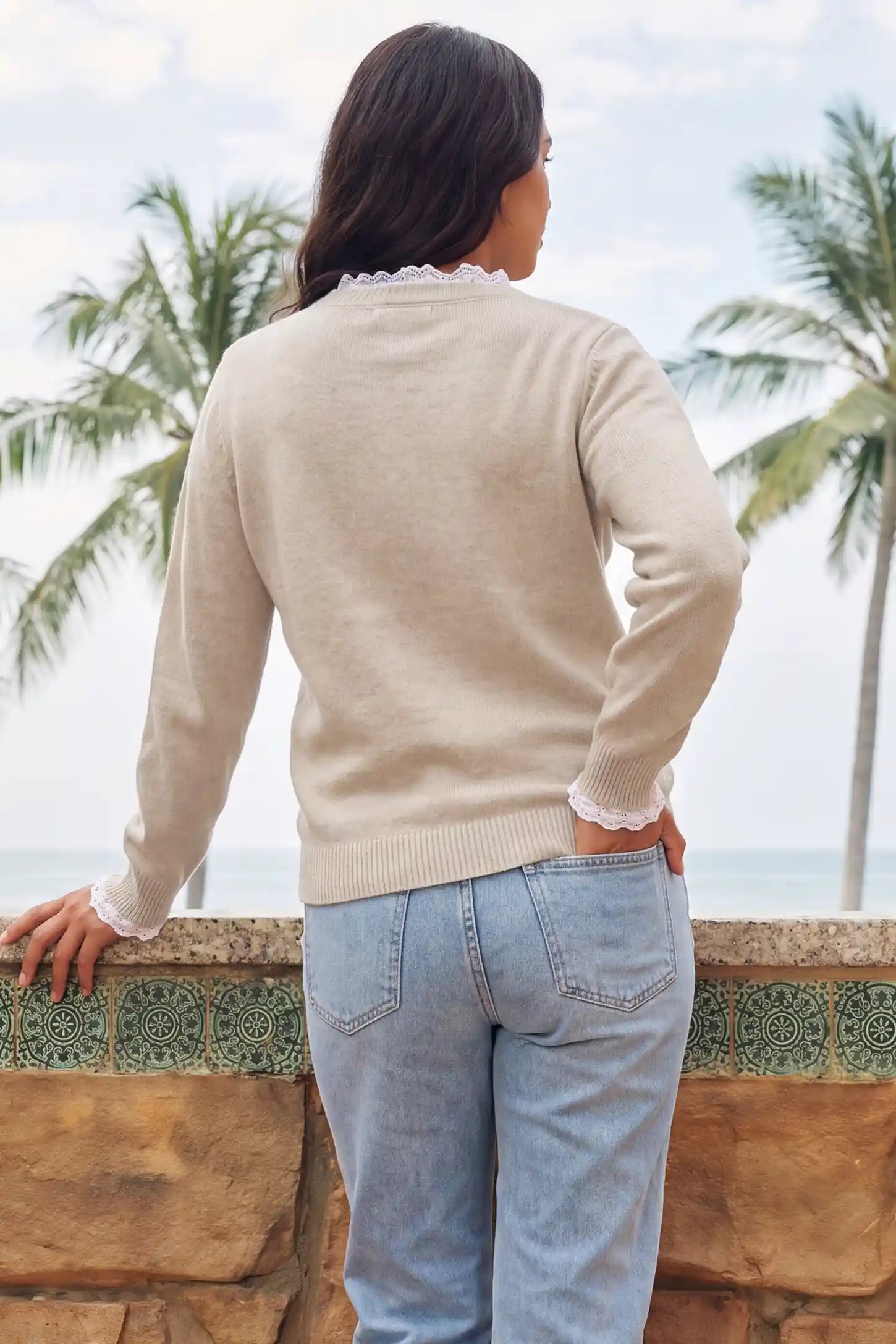 Lace-Trimmed Crewneck Maternity Knit Top Lace-Trimmed Crewneck Maternity Knit Top in Beige featuring full back coverage, soft knit fabric, delicate lace trim at cuffs, and comfortable fall wardrobe design on a pregnant model, back view.
