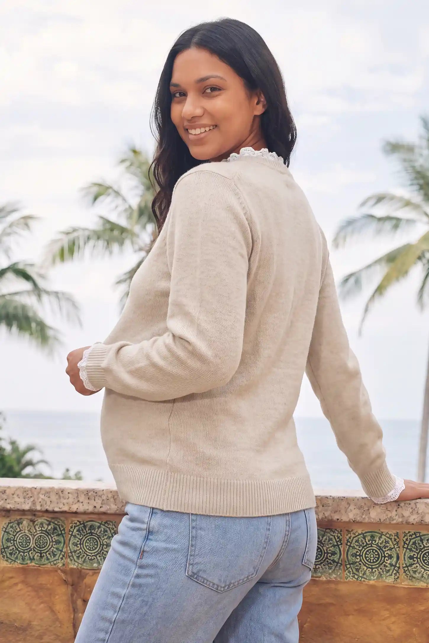 Lace-Trimmed Crewneck Maternity Knit Top Lace-Trimmed Crewneck Maternity Knit Top in Beige featuring accommodating belly stretch design, soft knit fabric, and gentle bump support on a pregnant model, side profile view.
