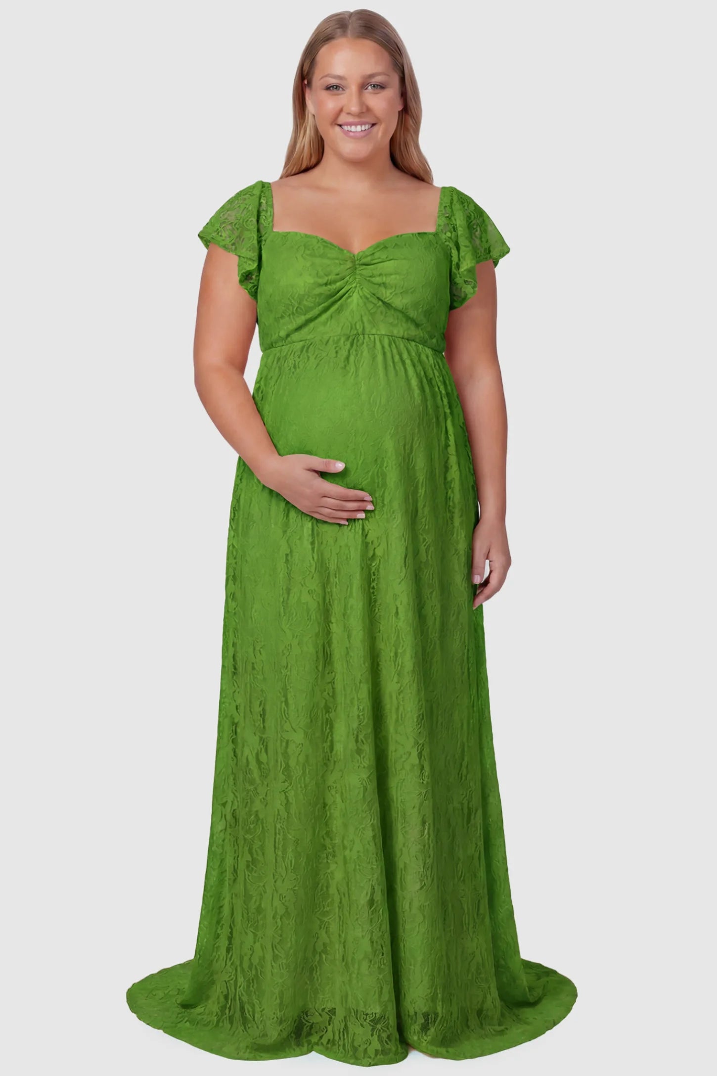 Lace Off Shoulder Maternity Maxi Dress Lace Off Shoulder Maternity Maxi Dress in apple green featuring a sweetheart neckline with a ruched bust and a full-length skirt, shown on a plus size pregnant model, front view.