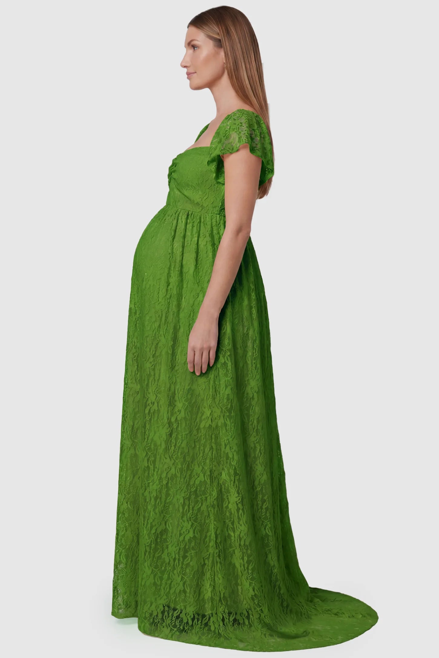 Lace Off Shoulder Maternity Maxi Dress Lace Off Shoulder Maternity Maxi Dress in apple green featuring a sweetheart neckline with a ruched bust and a full-length skirt, shown on a pregnant model, side view.