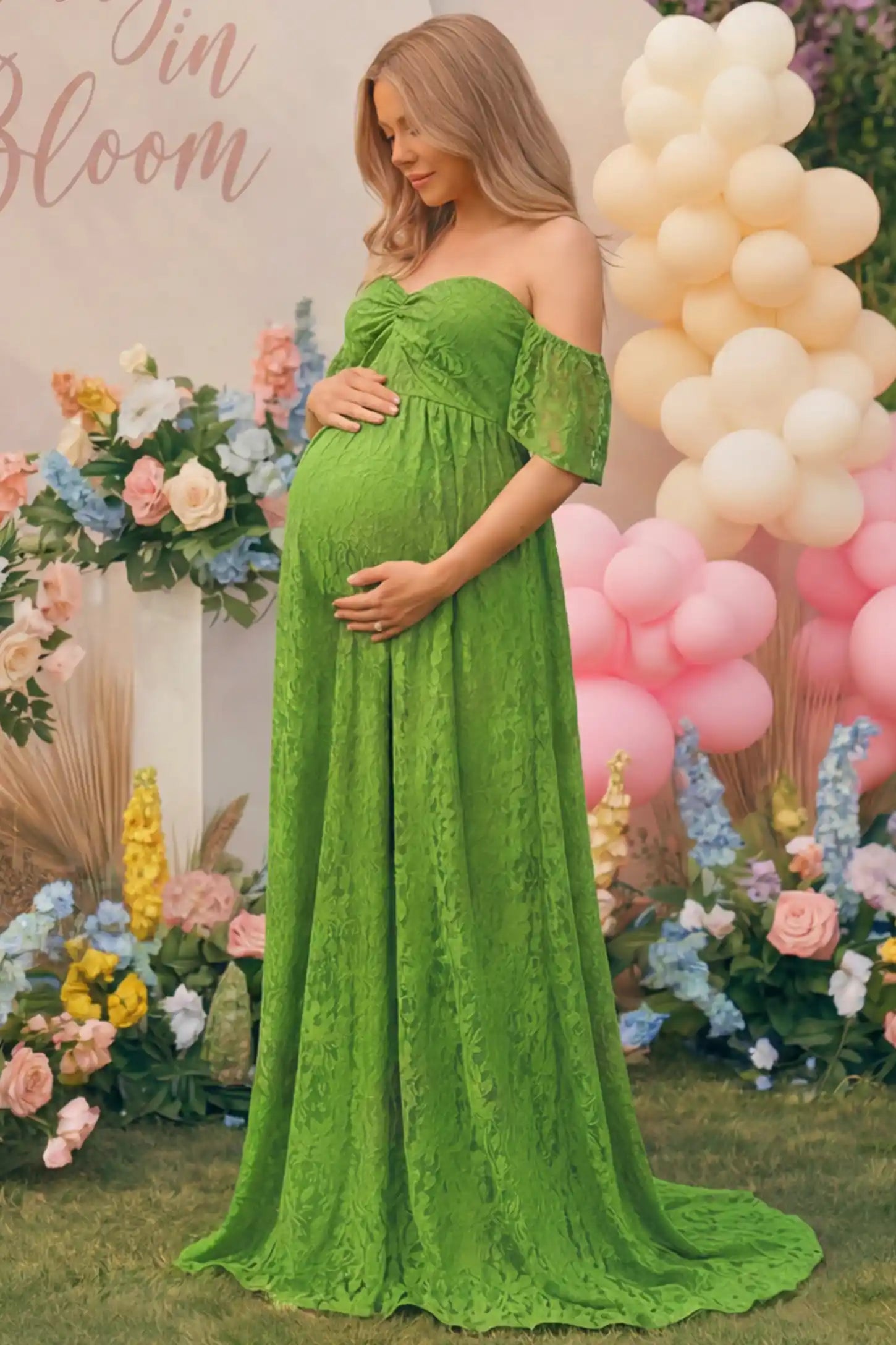 Lace Off Shoulder Maternity Maxi Dress Lace Off Shoulder Maternity Maxi Dress in apple green featuring a sweetheart neckline with a ruched bust and a full-length skirt, shown on a pregnant woman at a baby shower, side view.