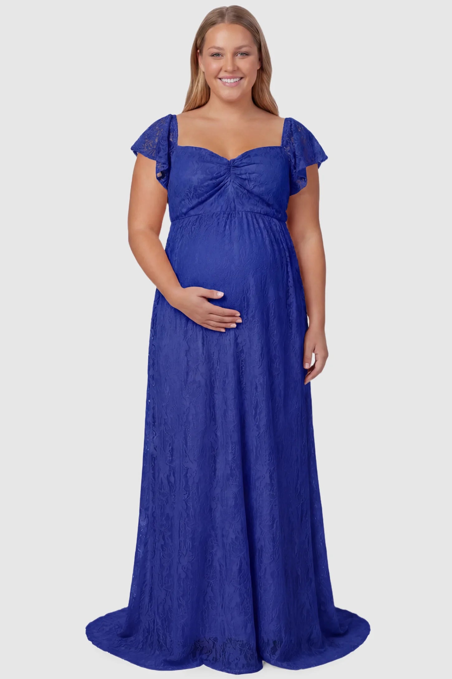 Lace Off Shoulder Maternity Maxi Dress Lace Off Shoulder Maternity Maxi Dress in blue featuring a sweetheart neckline with a ruched bust and a full-length skirt, shown on a plus size pregnant model, front view.