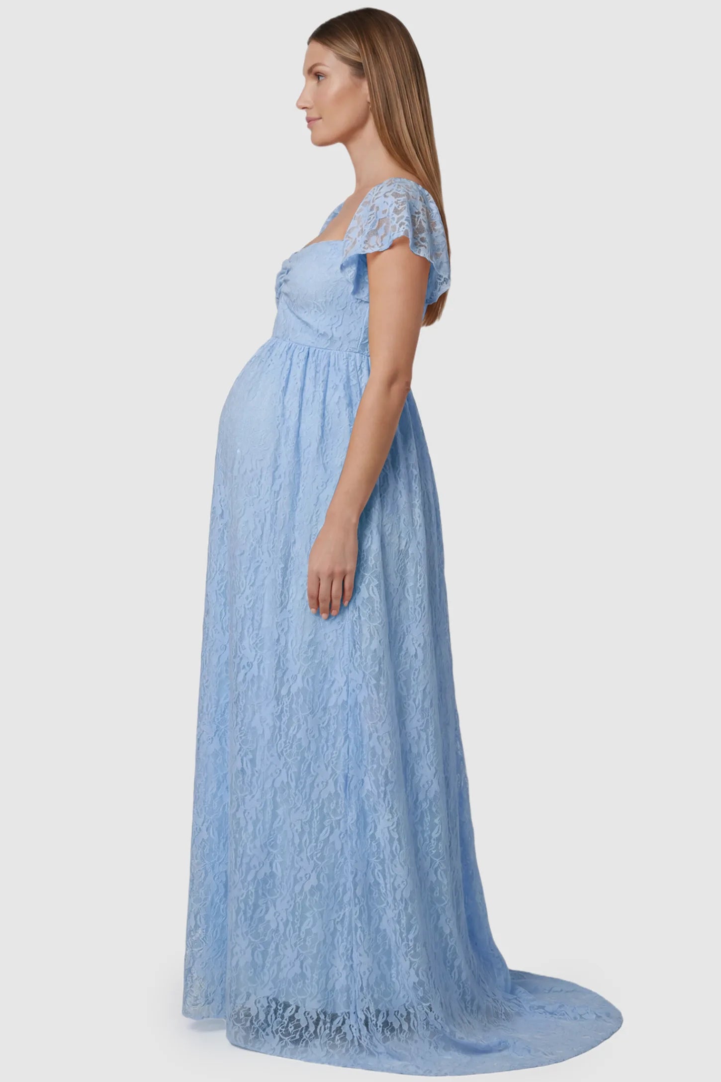 Lace Off Shoulder Maternity Maxi Dress Lace Off Shoulder Maternity Maxi Dress in light blue featuring a sweetheart neckline with a ruched bust and a full-length skirt, shown on a pregnant model, side view.
