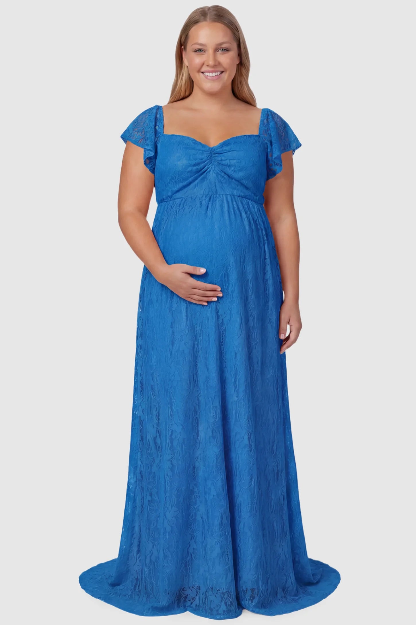 Lace Off Shoulder Maternity Maxi Dress Lace Off Shoulder Maternity Maxi Dress in ocean blue featuring a sweetheart neckline with a ruched bust and a full-length skirt, shown on a plus size pregnant model, front view.