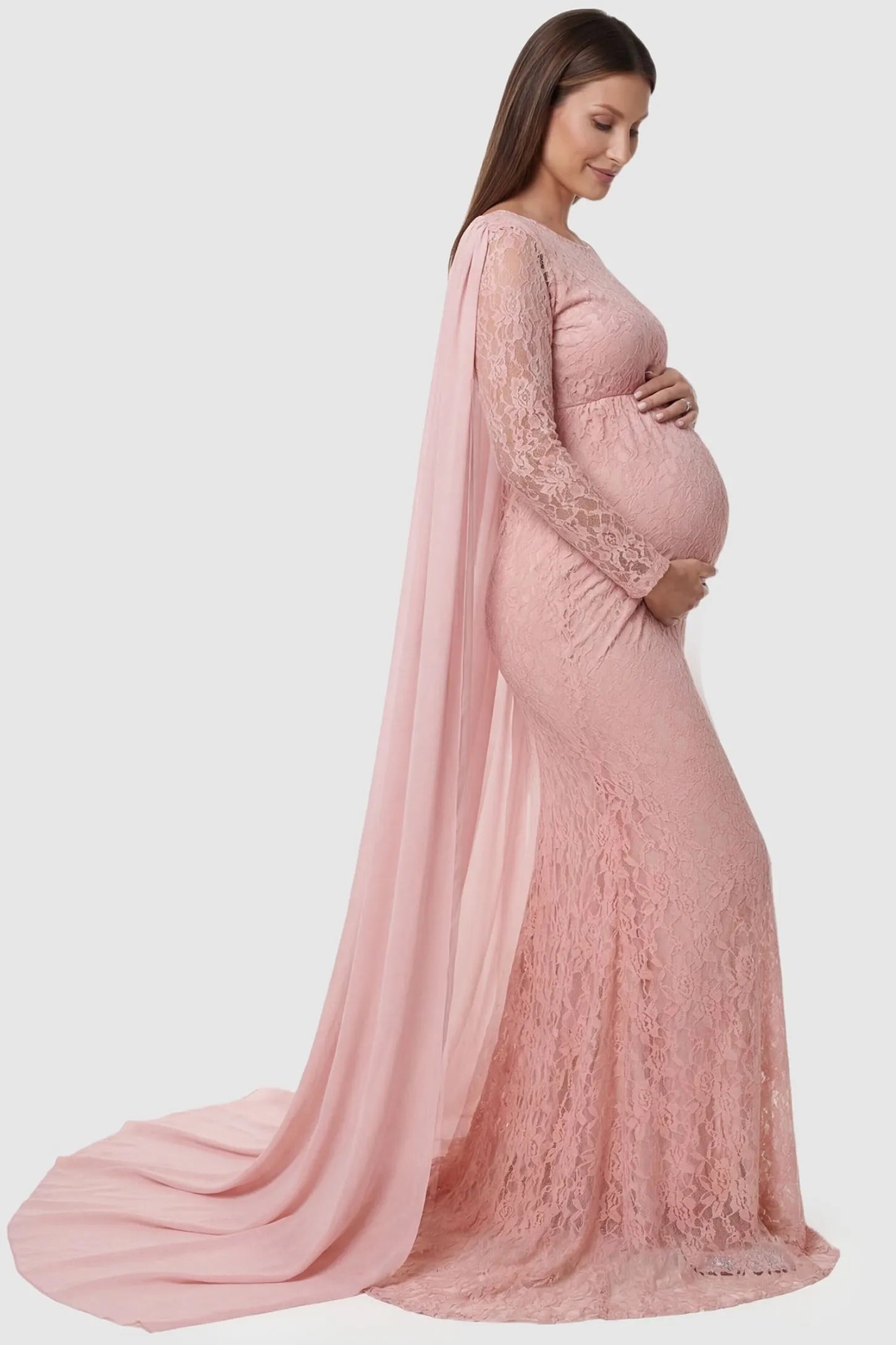 Lace & Chiffon Spliced Long Sleeve Maternity Photoshoot Gown Lace & Chiffon Spliced Maternity Photoshoot Gown in Fruit Pink featuring a sheer chiffon cape on a pregnant model side view.