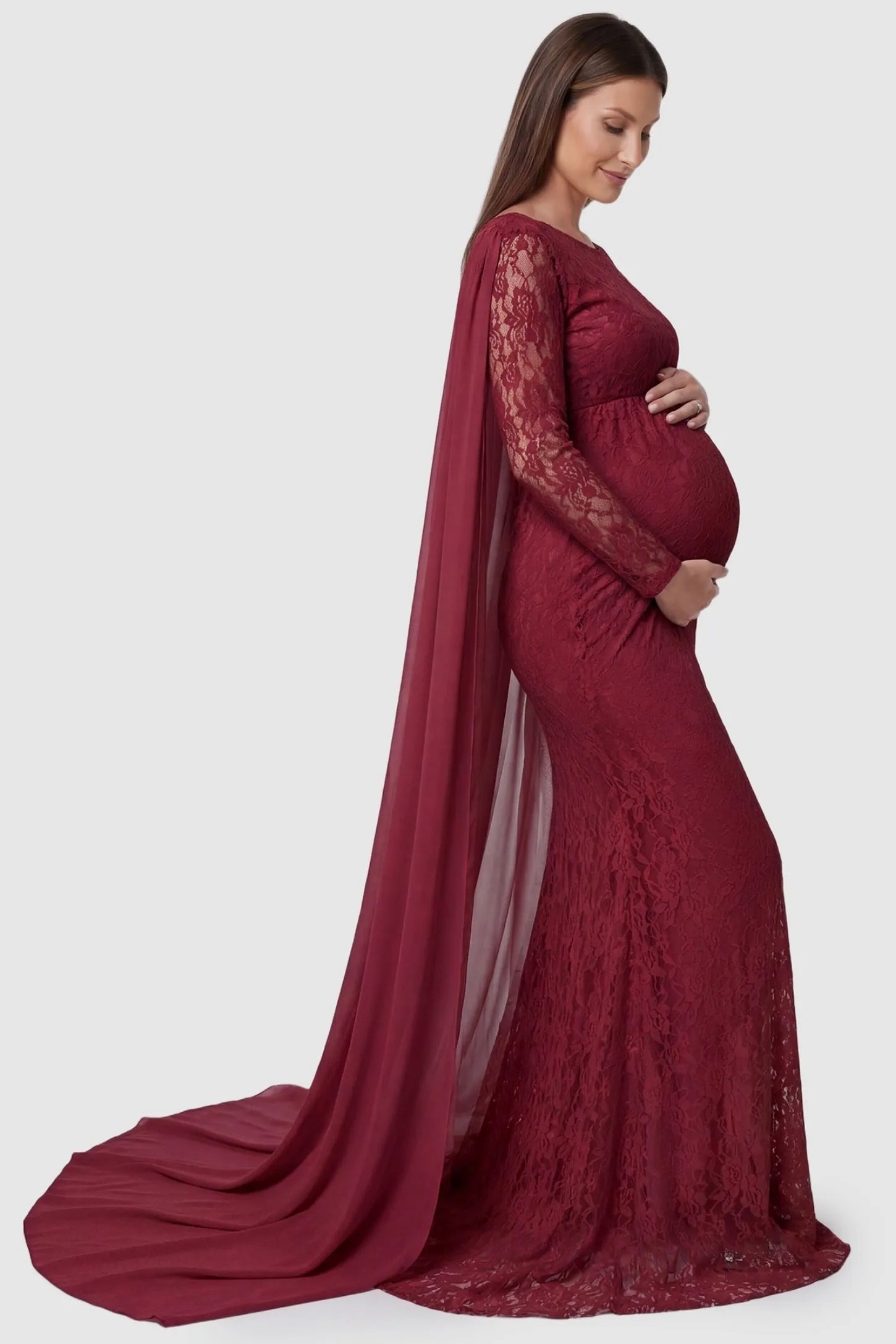 Lace & Chiffon Spliced Long Sleeve Maternity Photoshoot Gown Lace & Chiffon Spliced Maternity Photoshoot Gown in Wine Red featuring a sheer draped cape on a pregnant model side view.