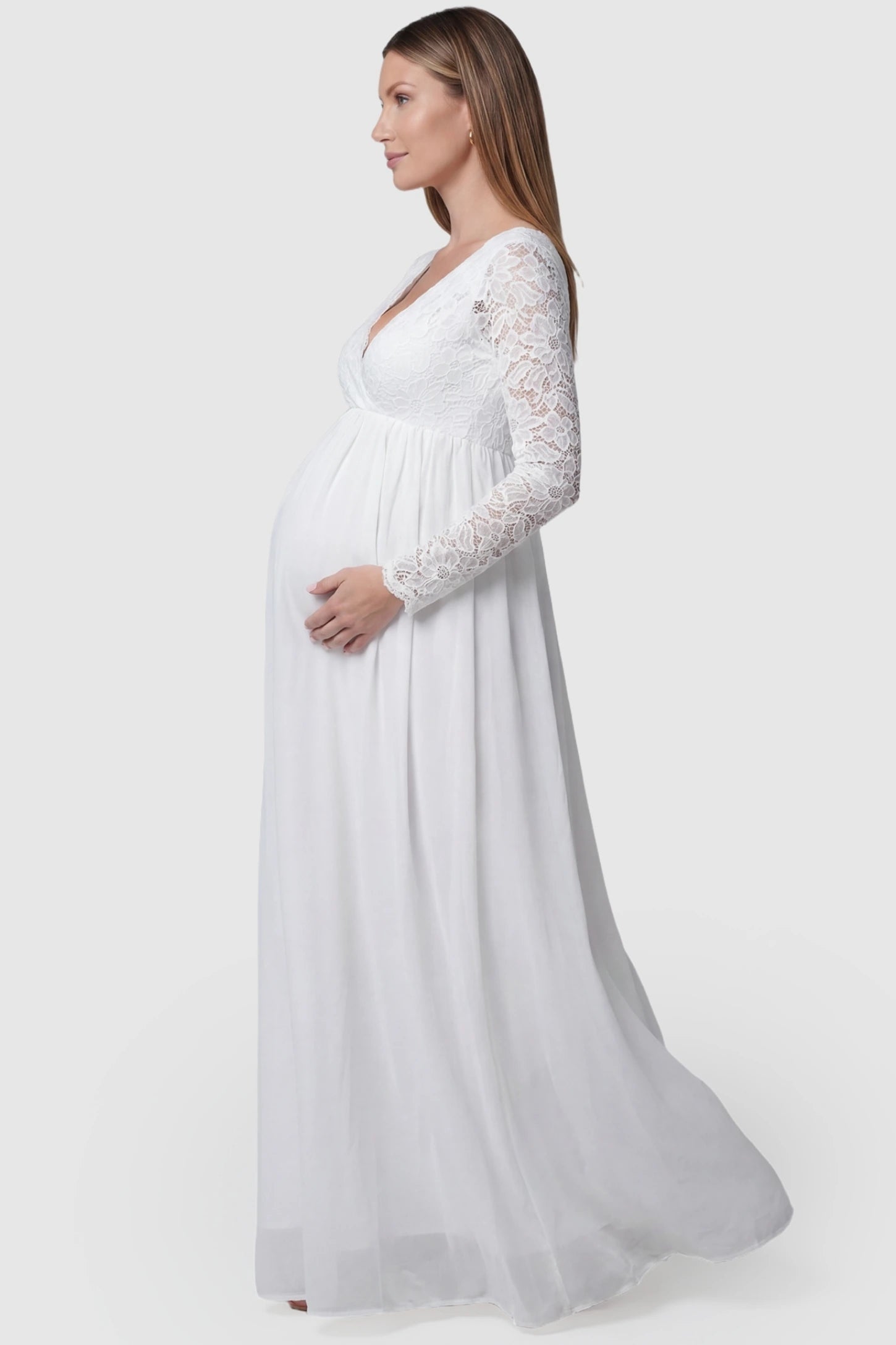 Lace & Chiffon Empire Waist Maternity Wedding Gown in White featuring a flowing skirt on a pregnant model.